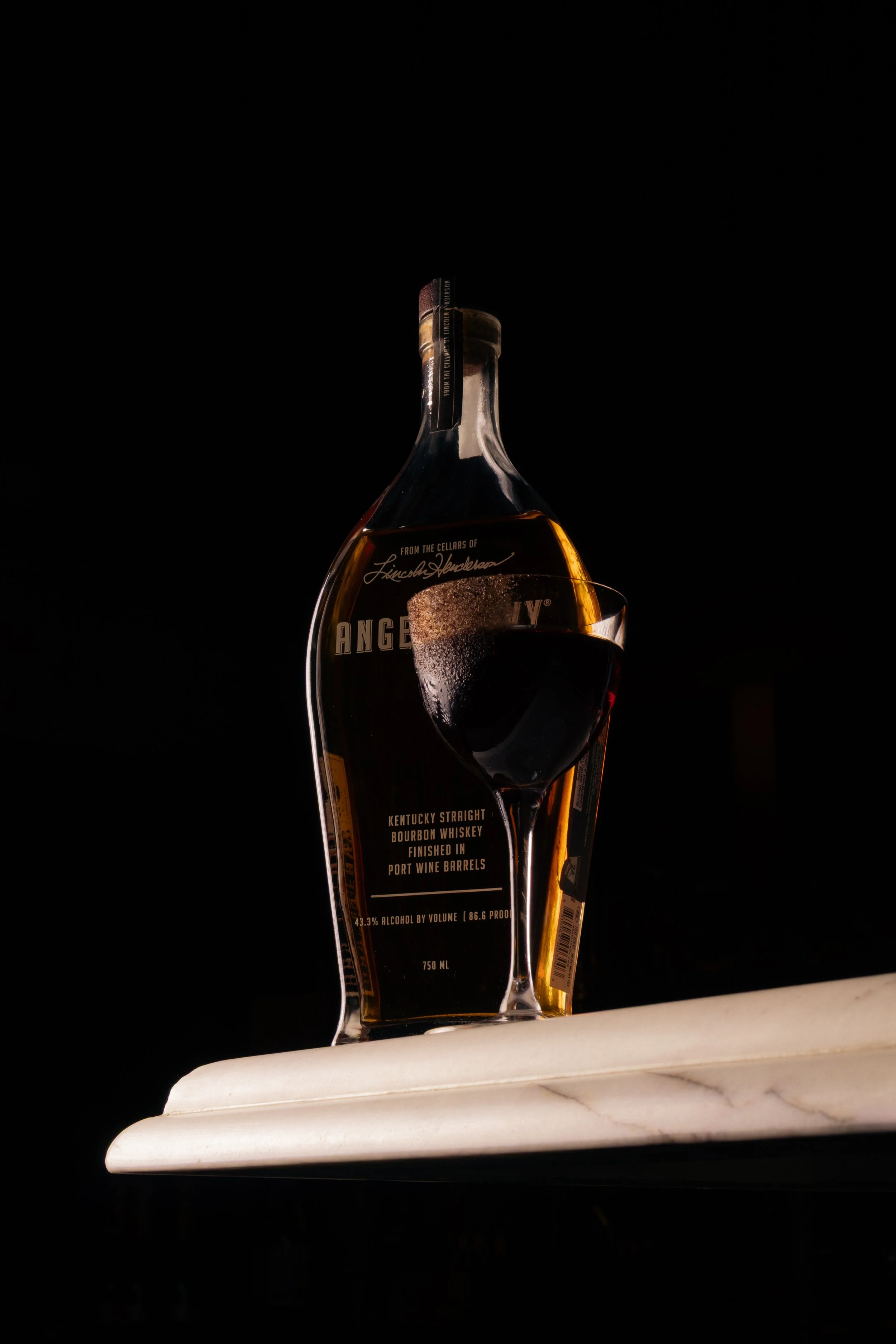 An image of Angel's Envy bourbon whisky and a cocktail made at Prahran steakhouse Angus & Bon.