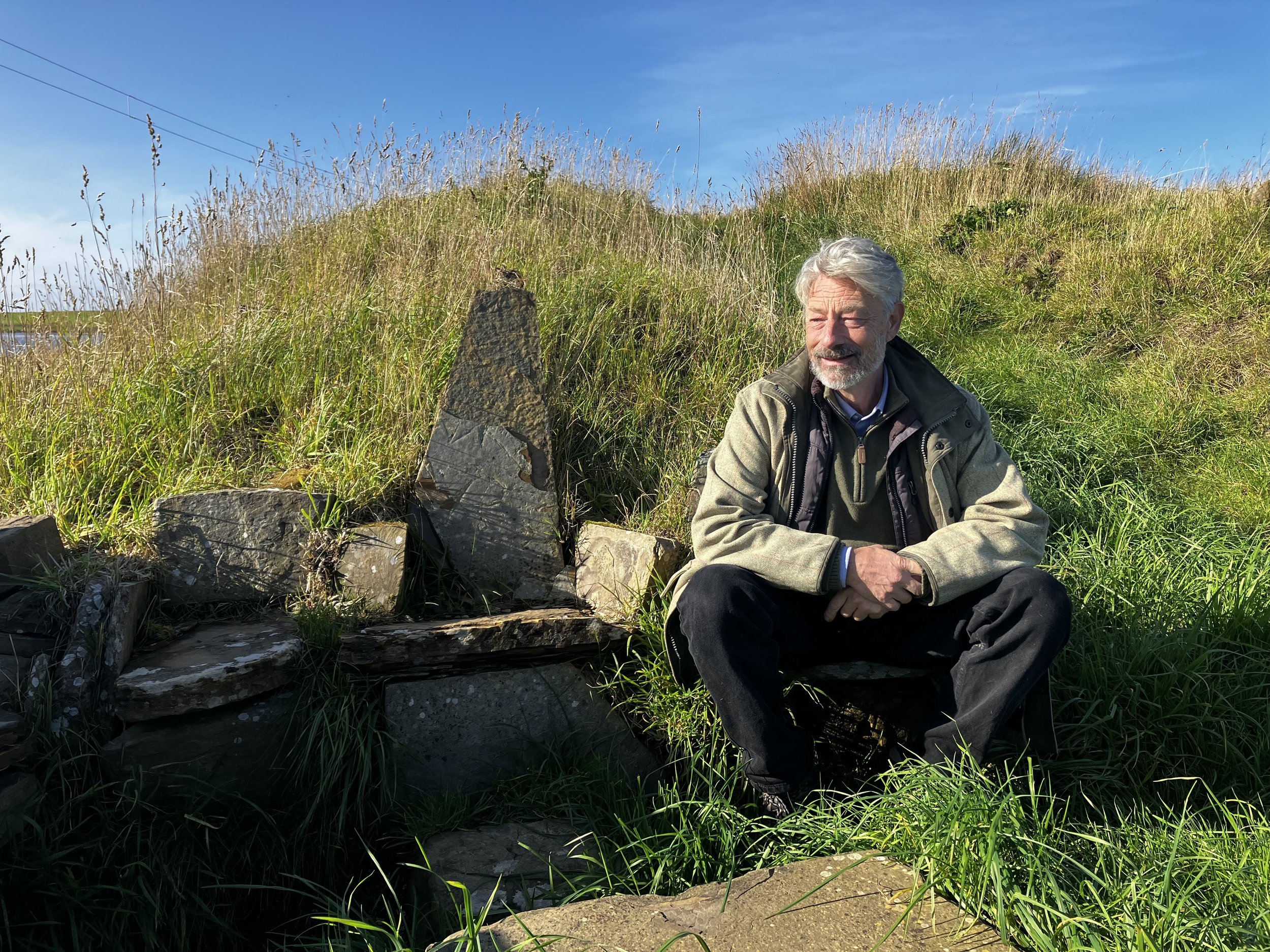 Patrick sitting by stone.jpg