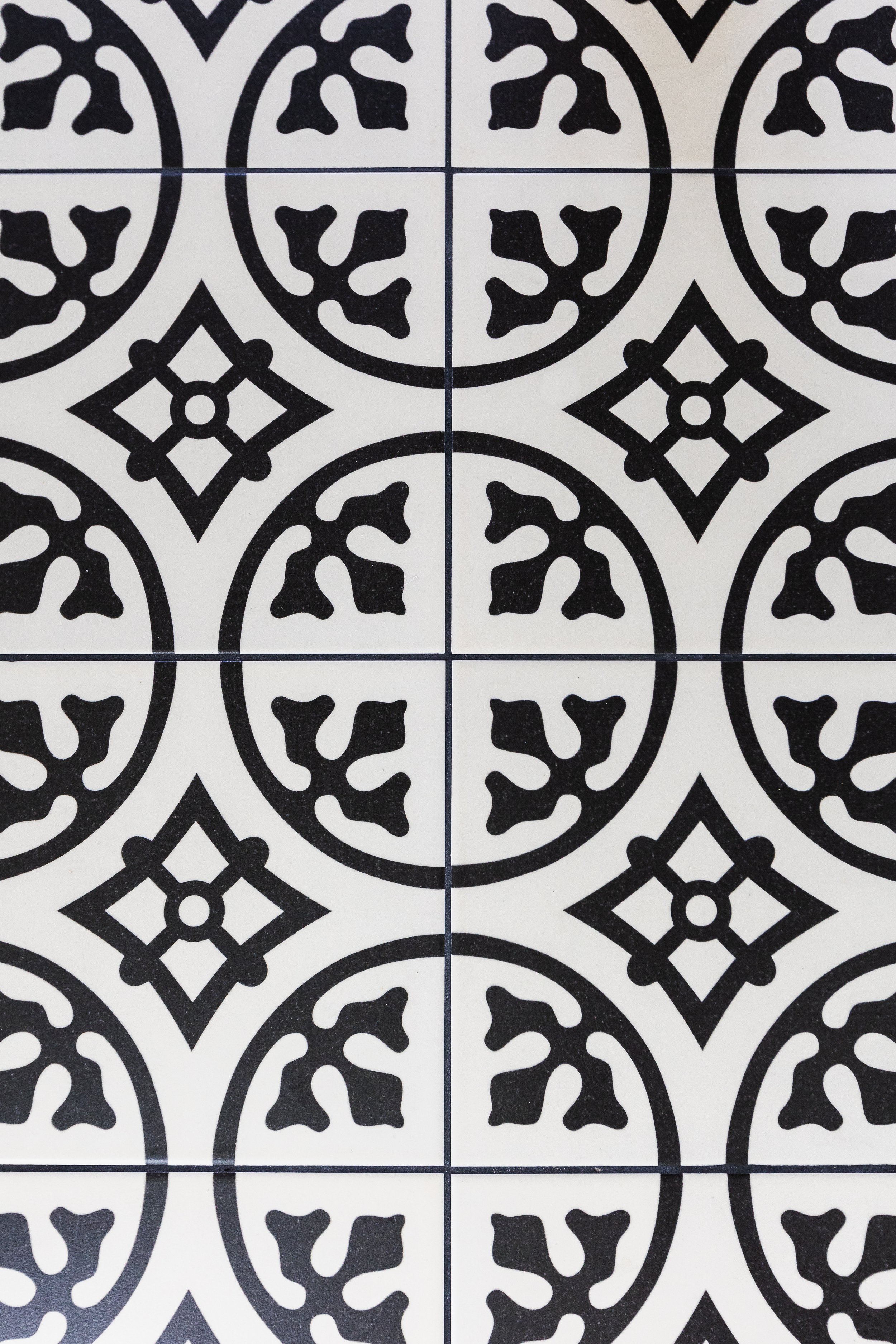 black and white geometric patterned floor tiles