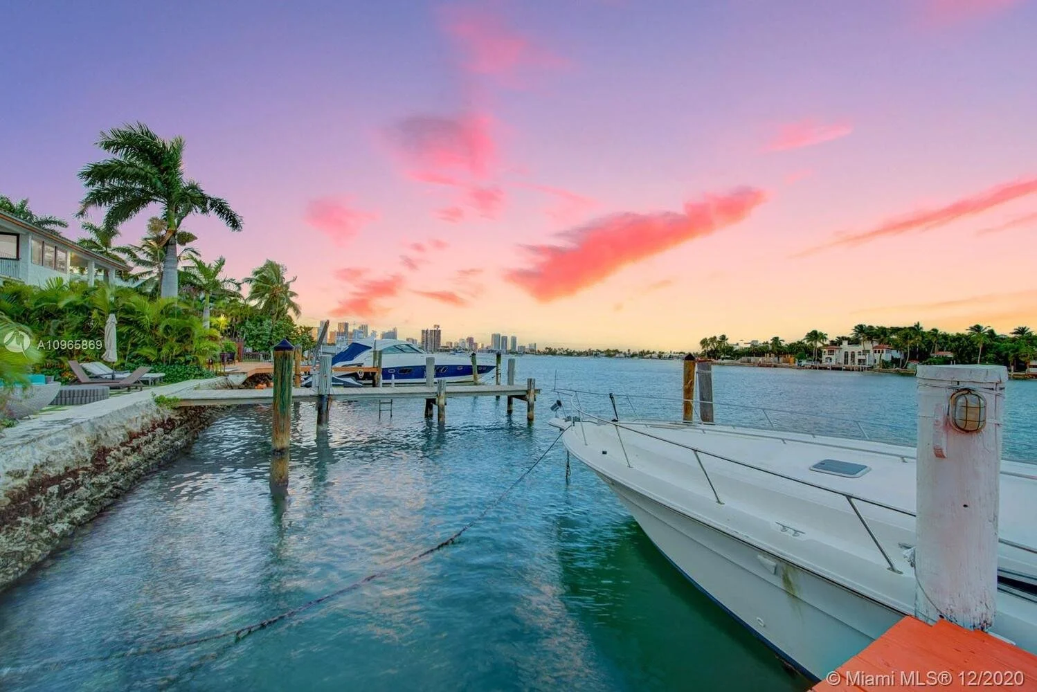 Waterfront dock with a yacht at sunset in Miami