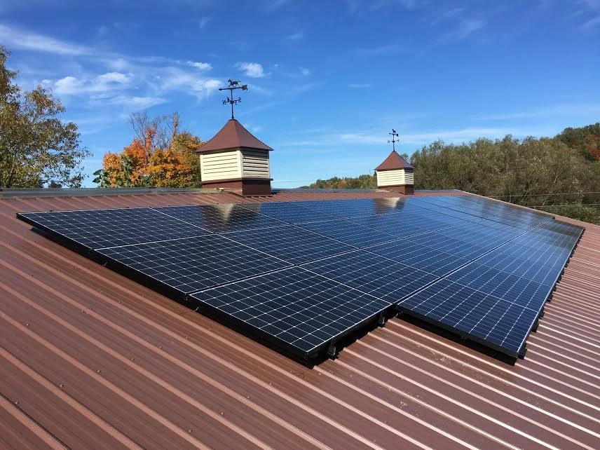 Solar panels on a roof with cupolas