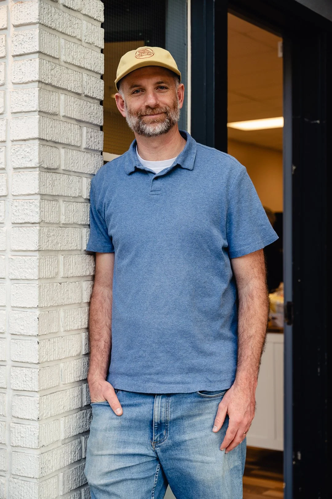 Man in front of his business
