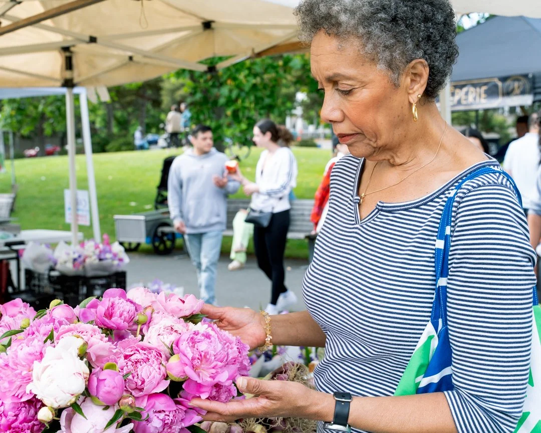 Women looking at flowers