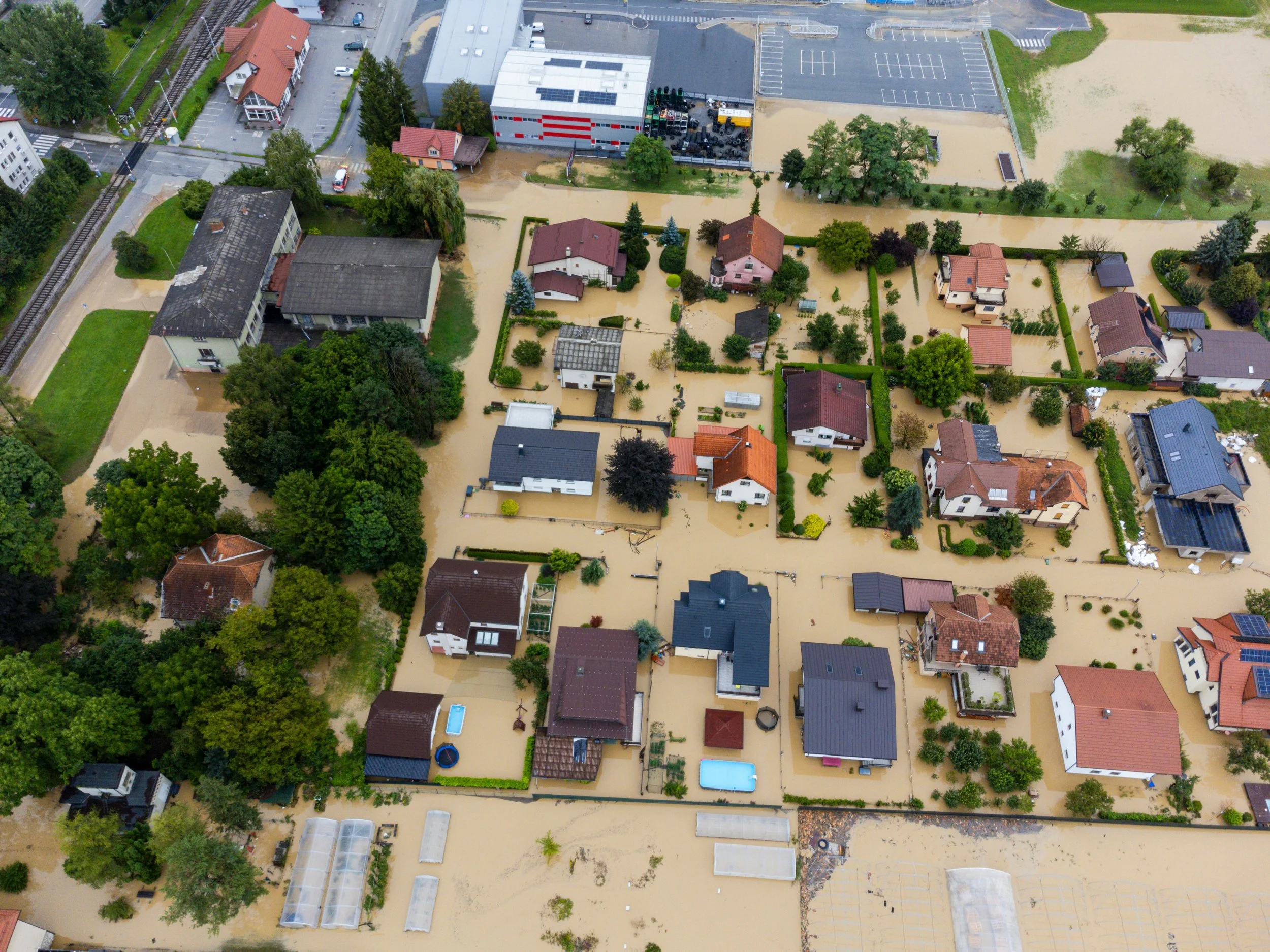 Aerial photo showing a residential neighborhood inundated in flood waters.