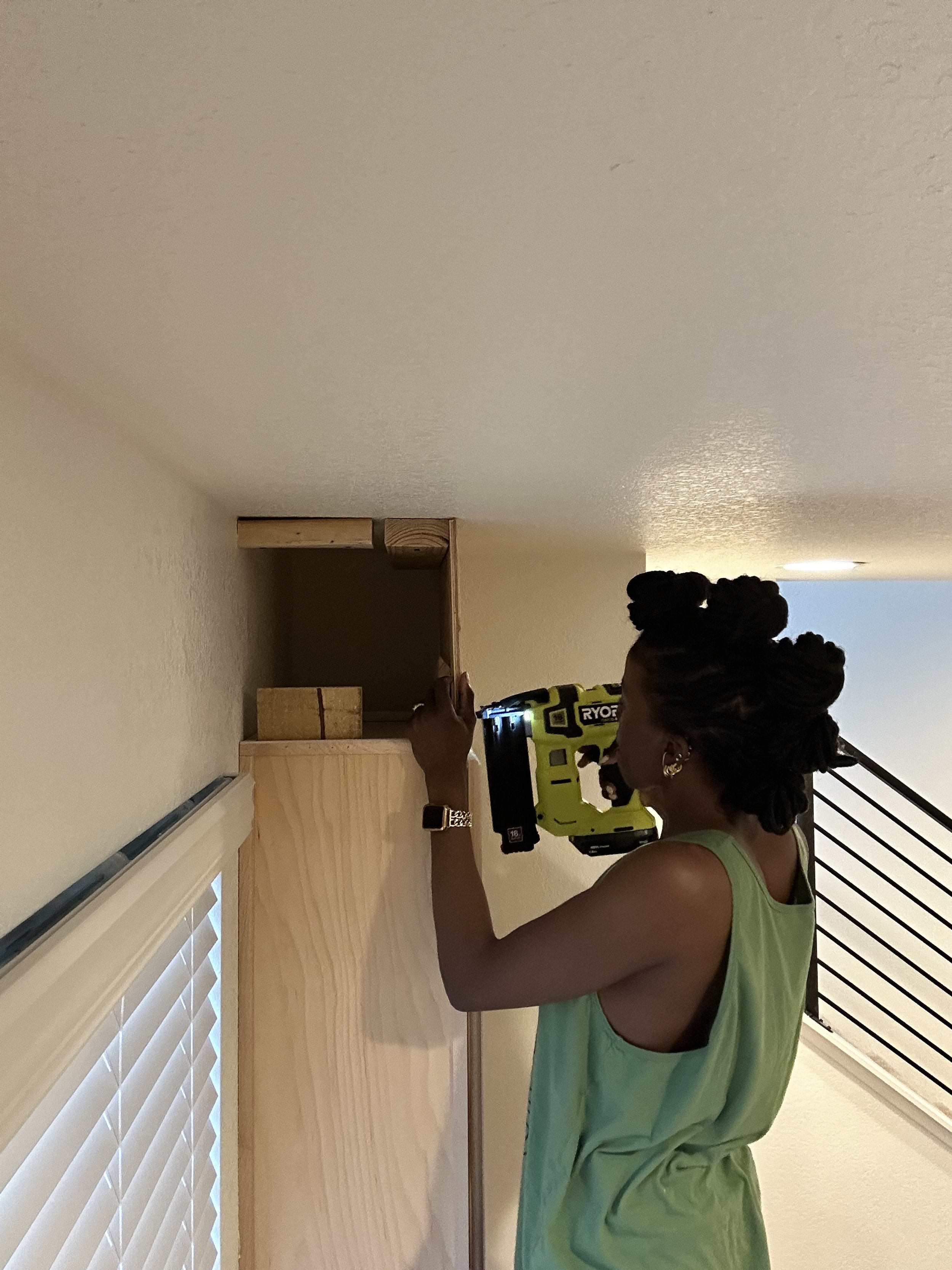 Black empowered woman working on the kitchen of her new build dream home.