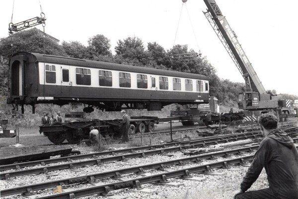 A day after the previous picture, 25040 is seen being craned off the lorry it was transported with, onto its bogies in Bitton Yard. 