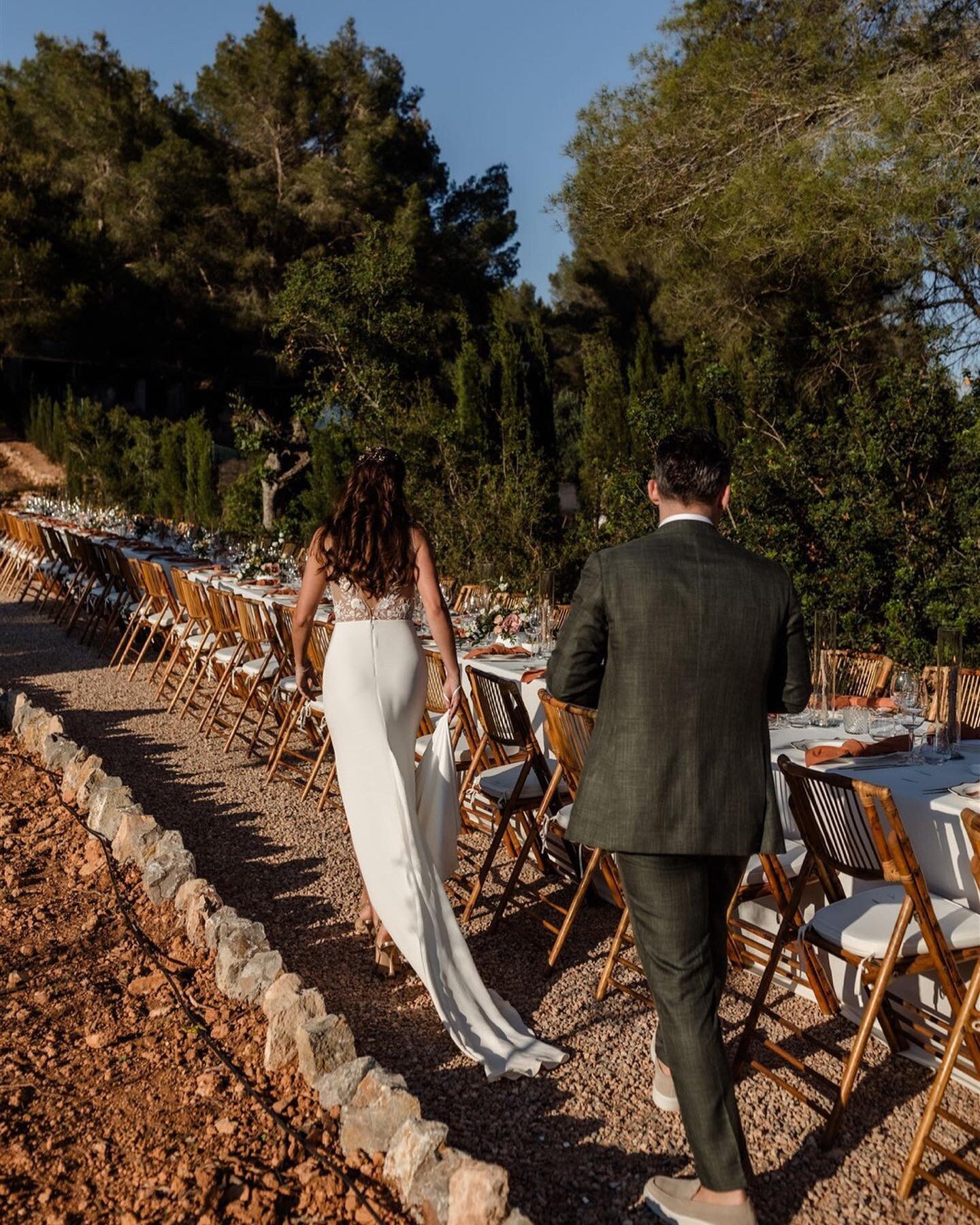 Dinner details on Ibiza last summer in a private backyard. Portraits and cherished moments are essential in our series, but it's the little details that truly bring it all together. How about that canvas on the tree with the table setting on it &ndas