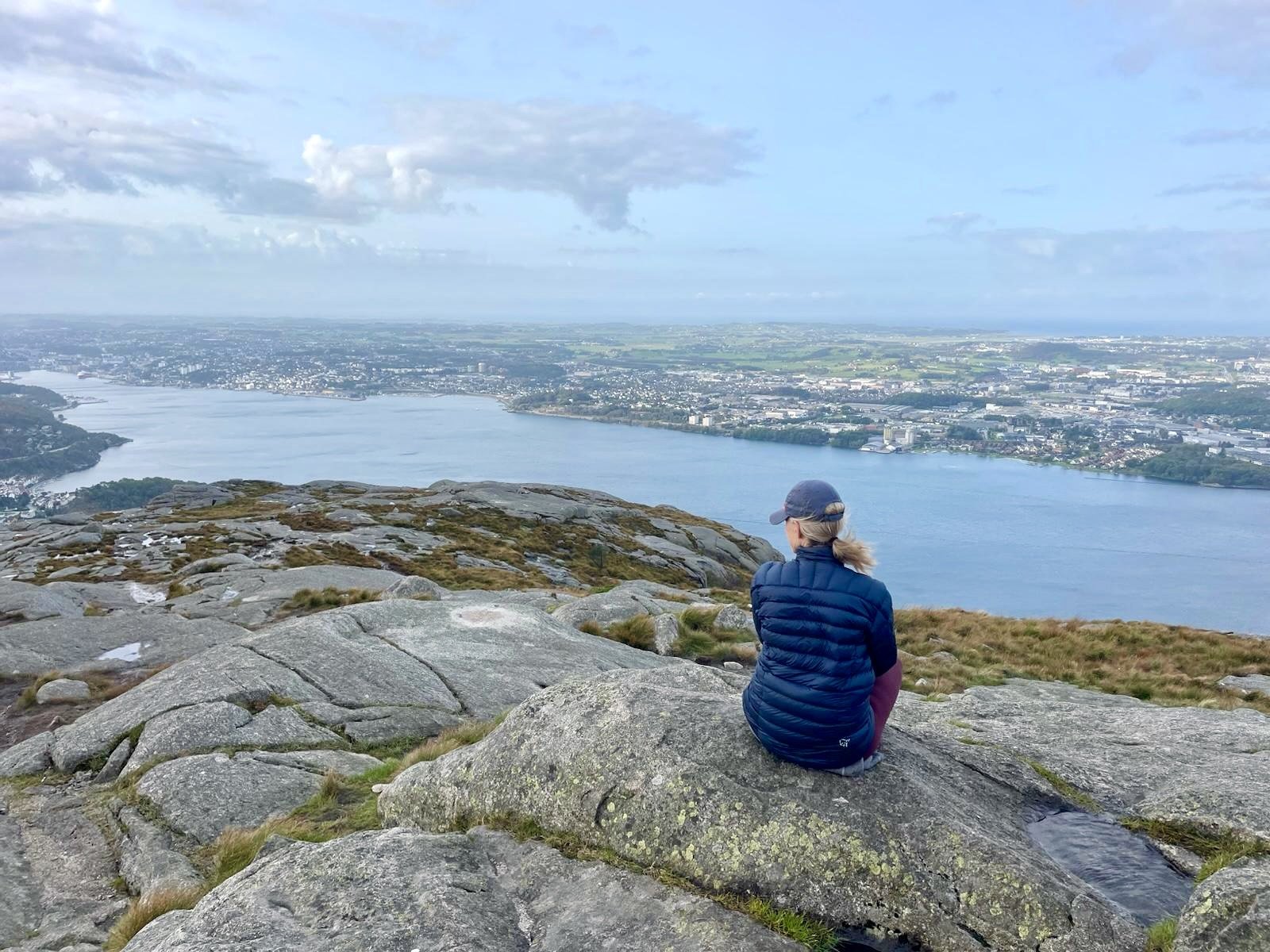 Woman in a calm, grounded posture, practicing presence and body awareness through stillness and breath