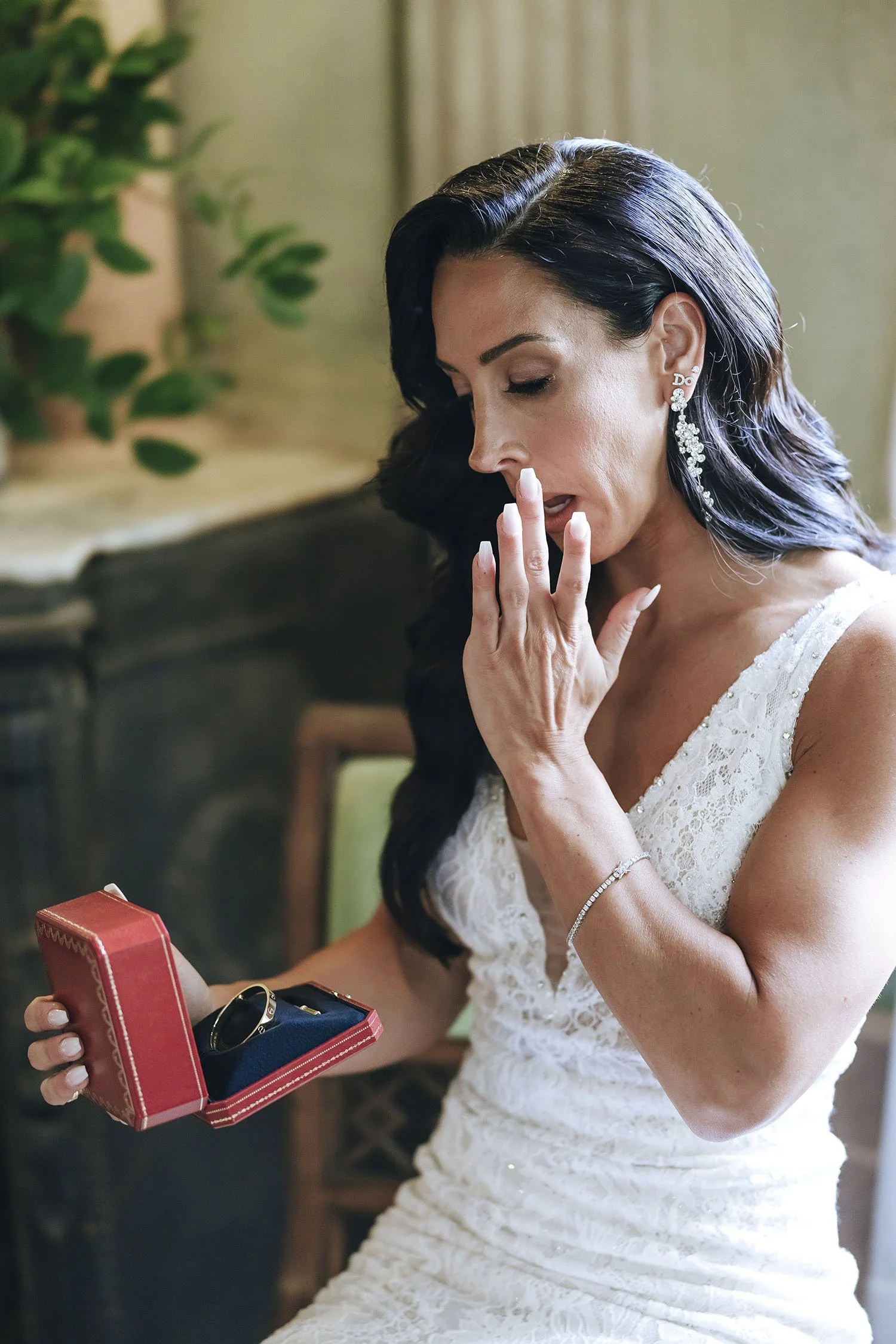 the bride cries receiving a gift from the groom
