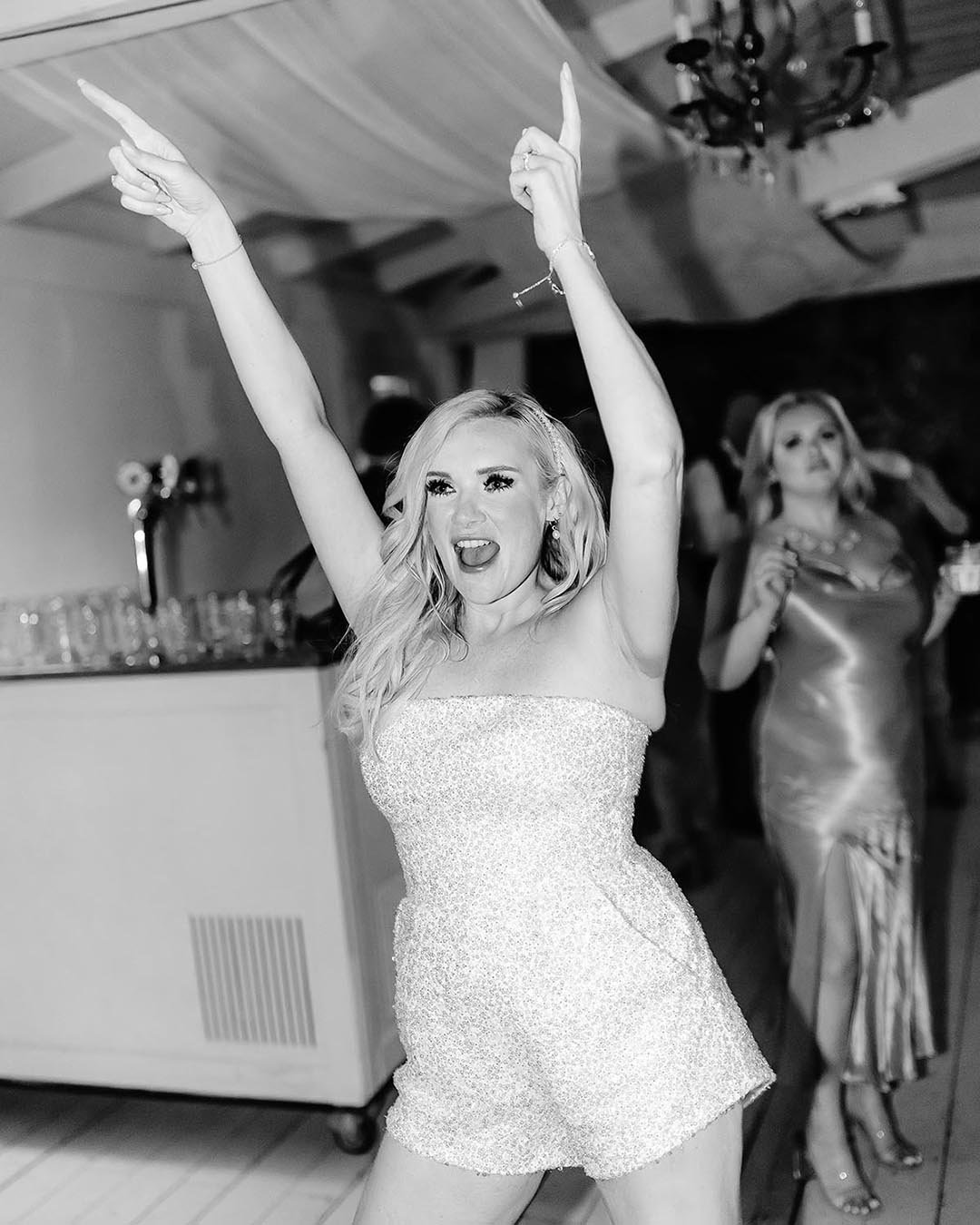 bride celebrating and dancing during her party