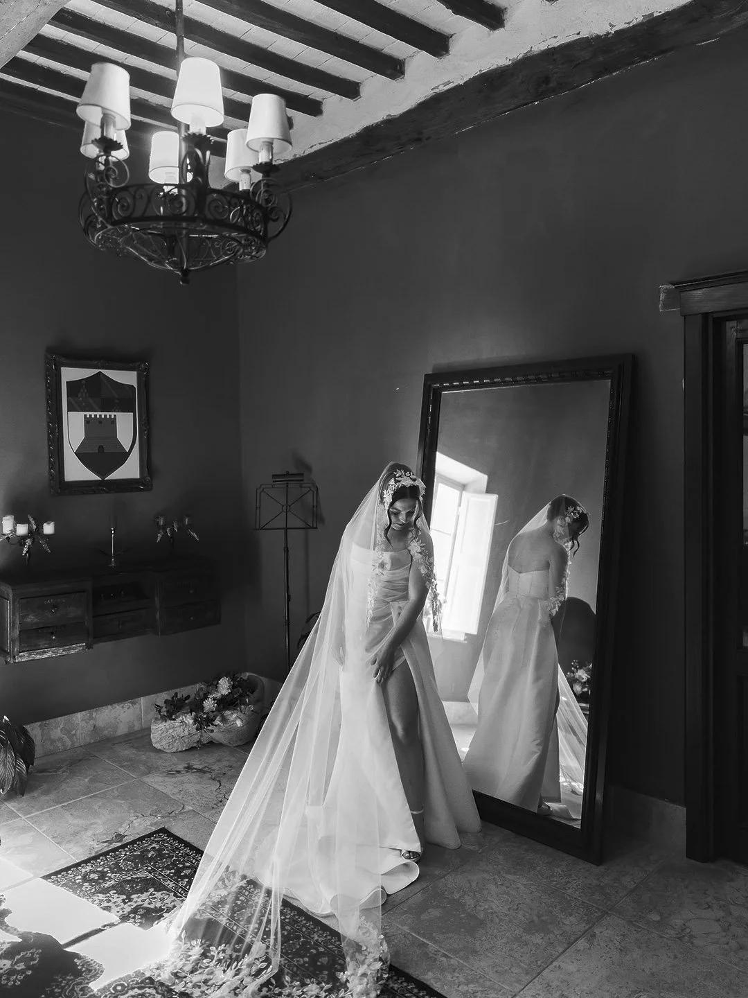 bride looking hersekf in the mirror