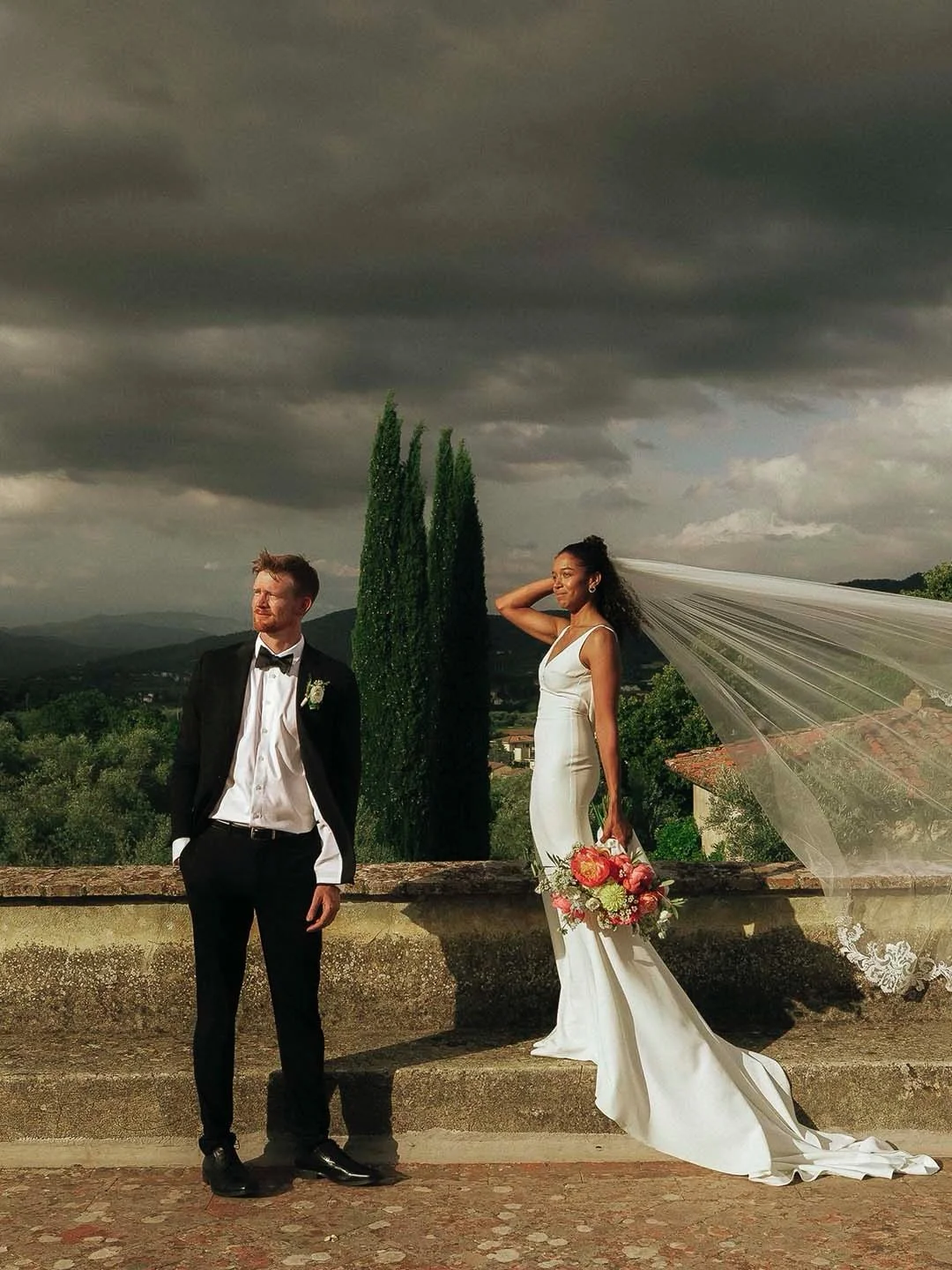 Dan &amp; Stefanie | Villa Medicea di Lilliano, Tuscany
Imagine saying &ldquo;I do&rdquo; on a sun-drenched terrace with the Duomo of Florence peeking through the distant hills. 
The ceremony unfolded beneath a breathtaking floral arch made by @lilla