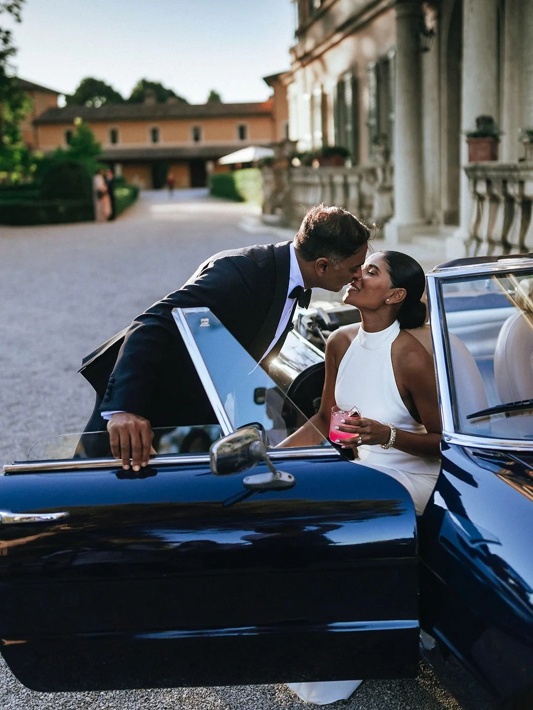 A vibrant wedding celebration at a 16th-century villa, blending Indian traditions with Italian charm.
The ceremony took place in the villa&rsquo;s theater decorated with deep red, blush florals and fresh grren tones, leading into a cocktail hour with