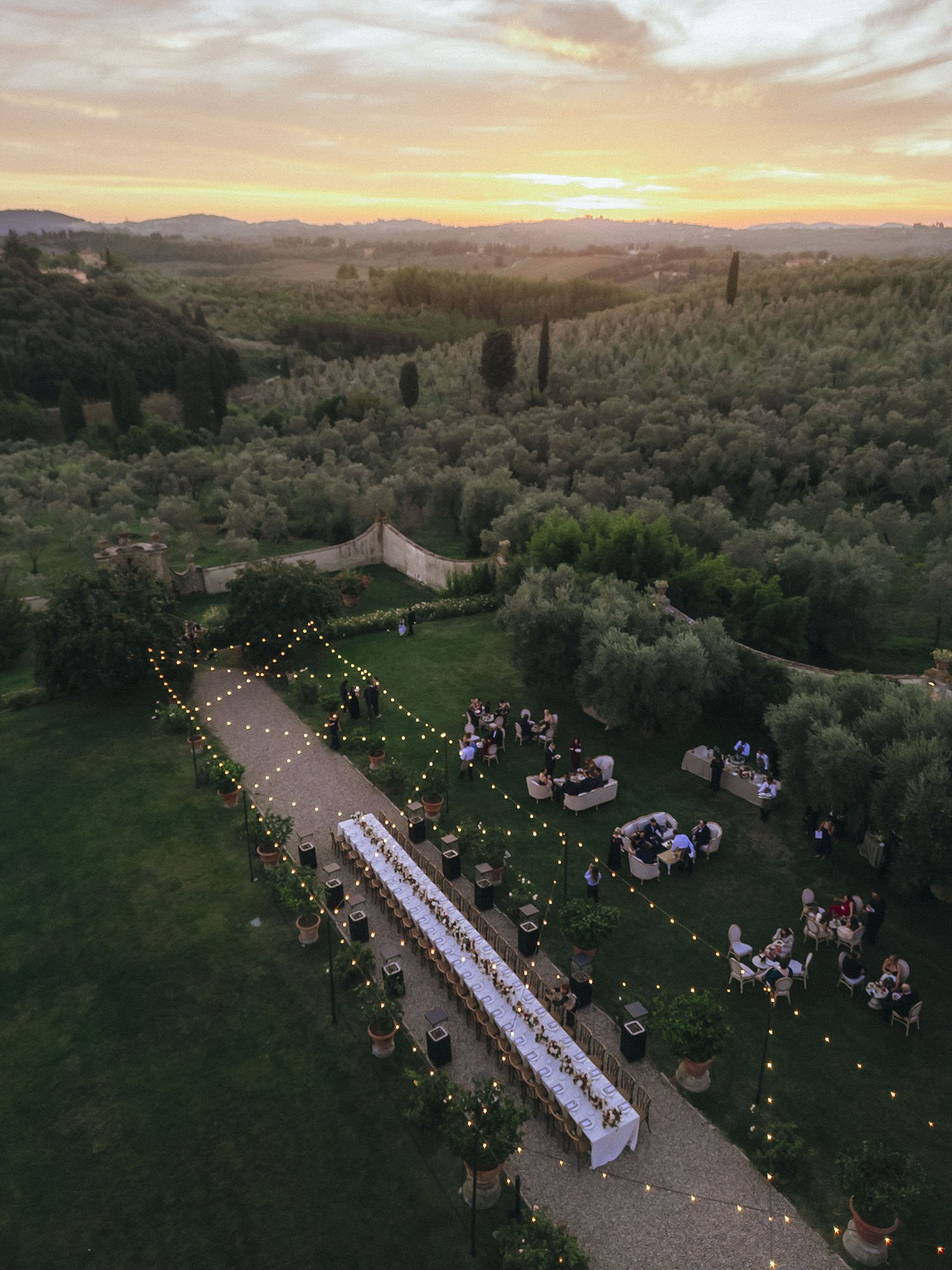 Aerial view of the dinner table at Villa Medicea di Lilliano with a stunning sunset