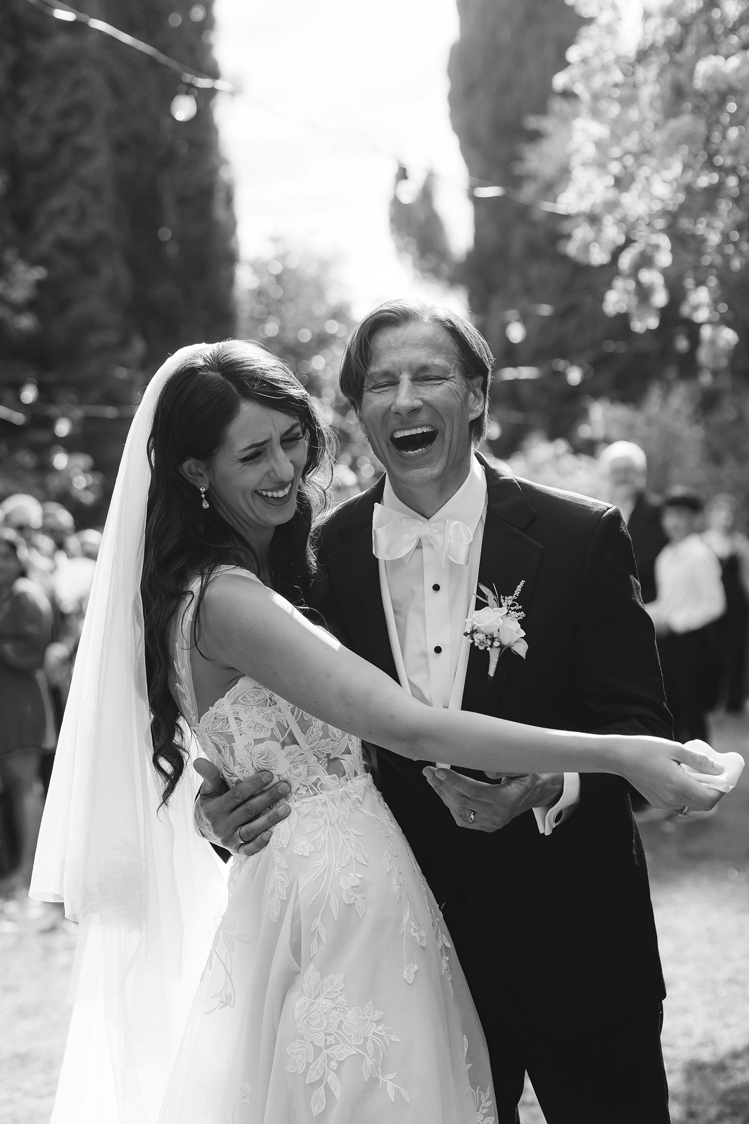 Destination wedding at Montegufoni castle near Florence in Tuscany. Bride and groom in tears after the ceremony