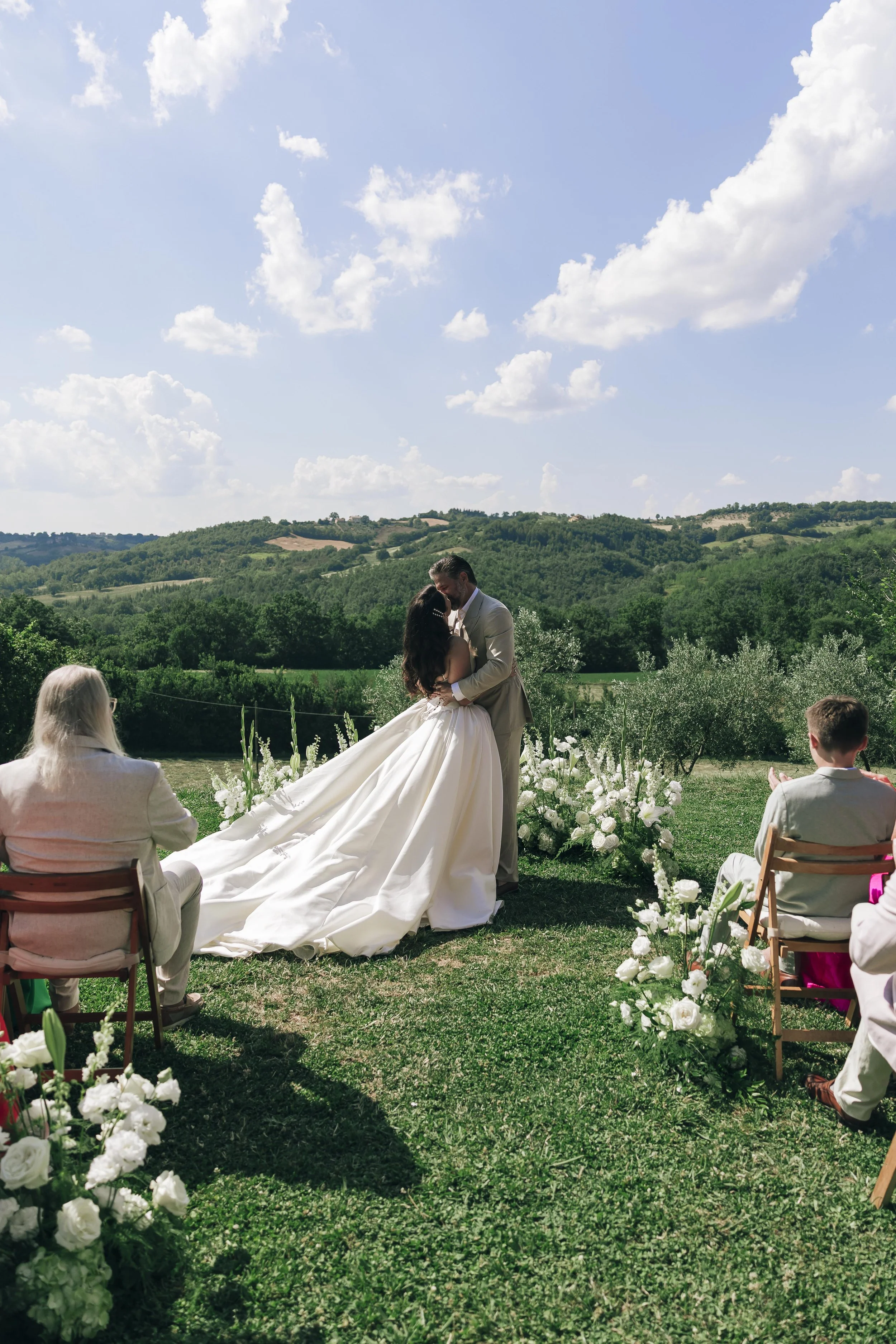 bride and groom kiss during the ceremony at Borgo Castello Panicaglia