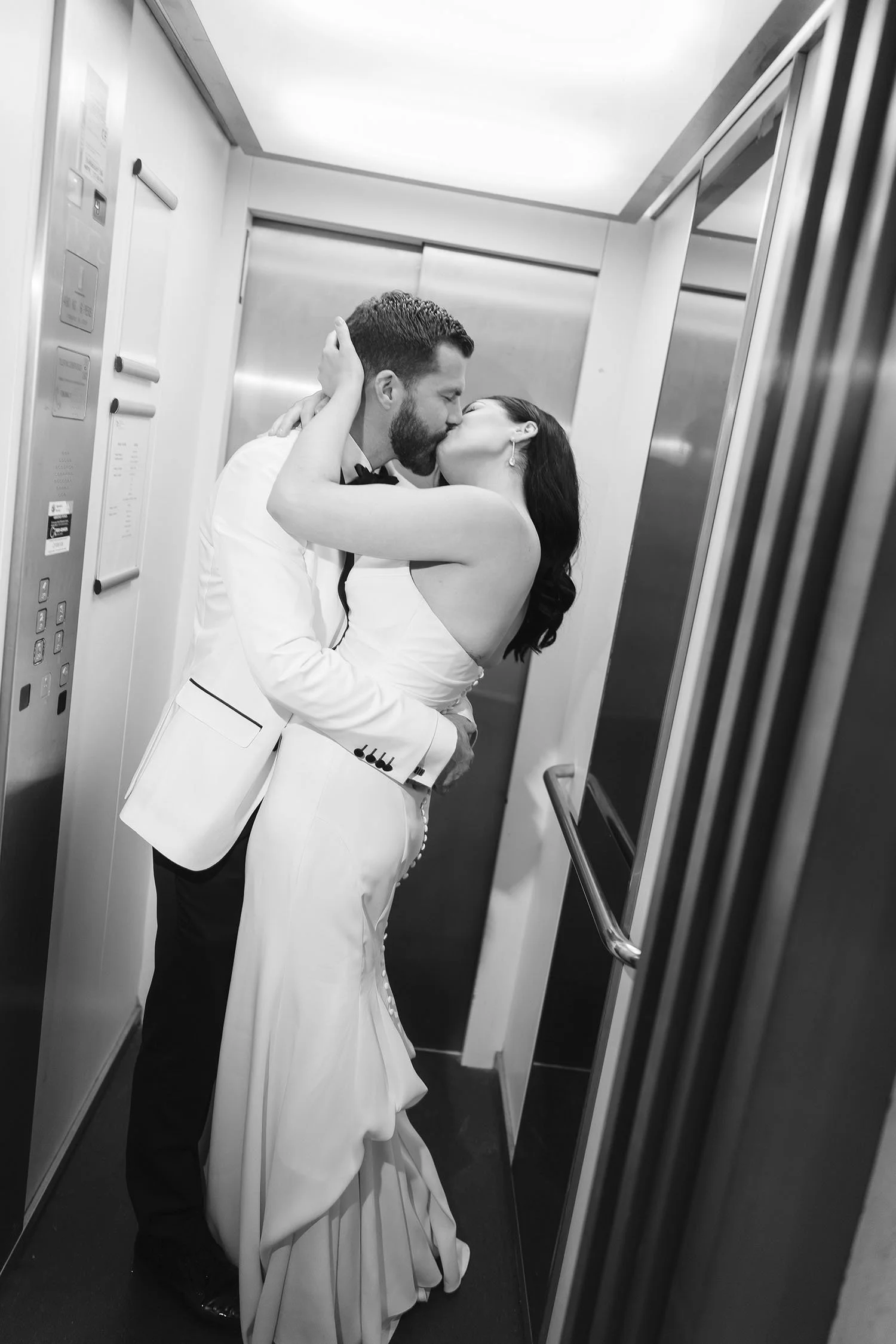 Romantic kiss in the elevator photo magazine style by Rellini art studio, best wedding photographers in Italy