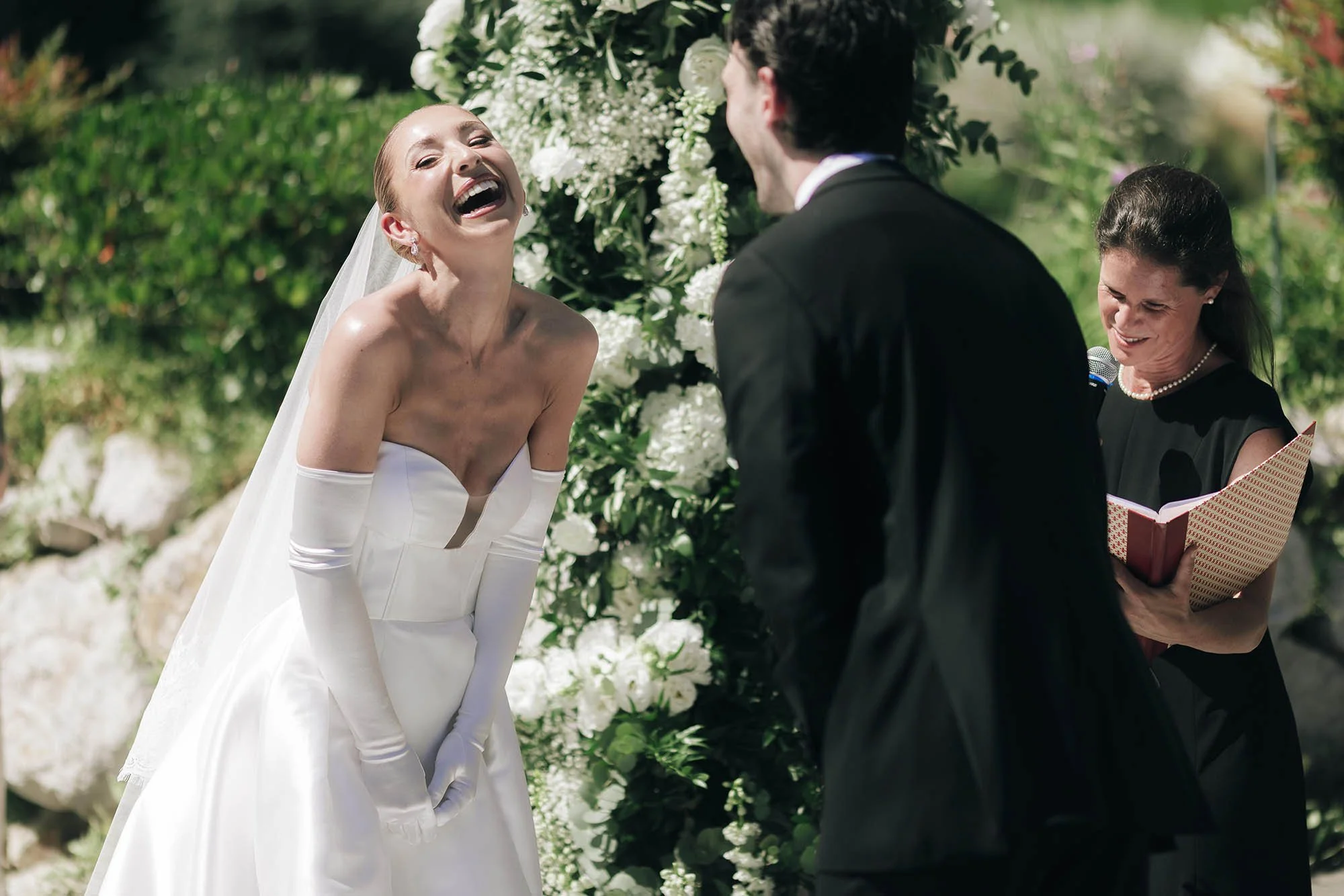nice moment of the bride laughing during the ceremony