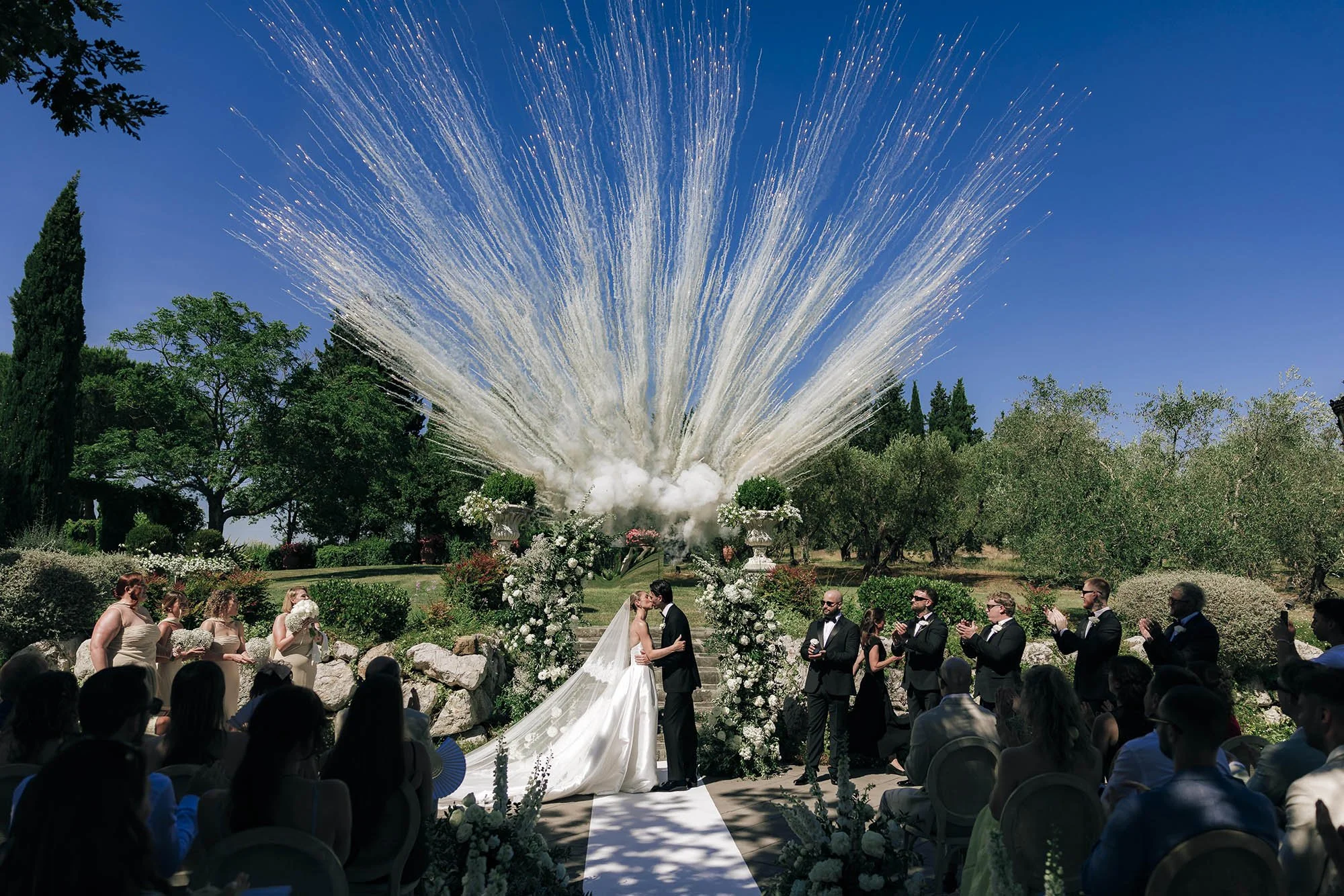 wite smoke bombs at the moment of the first kiss during the ceremony