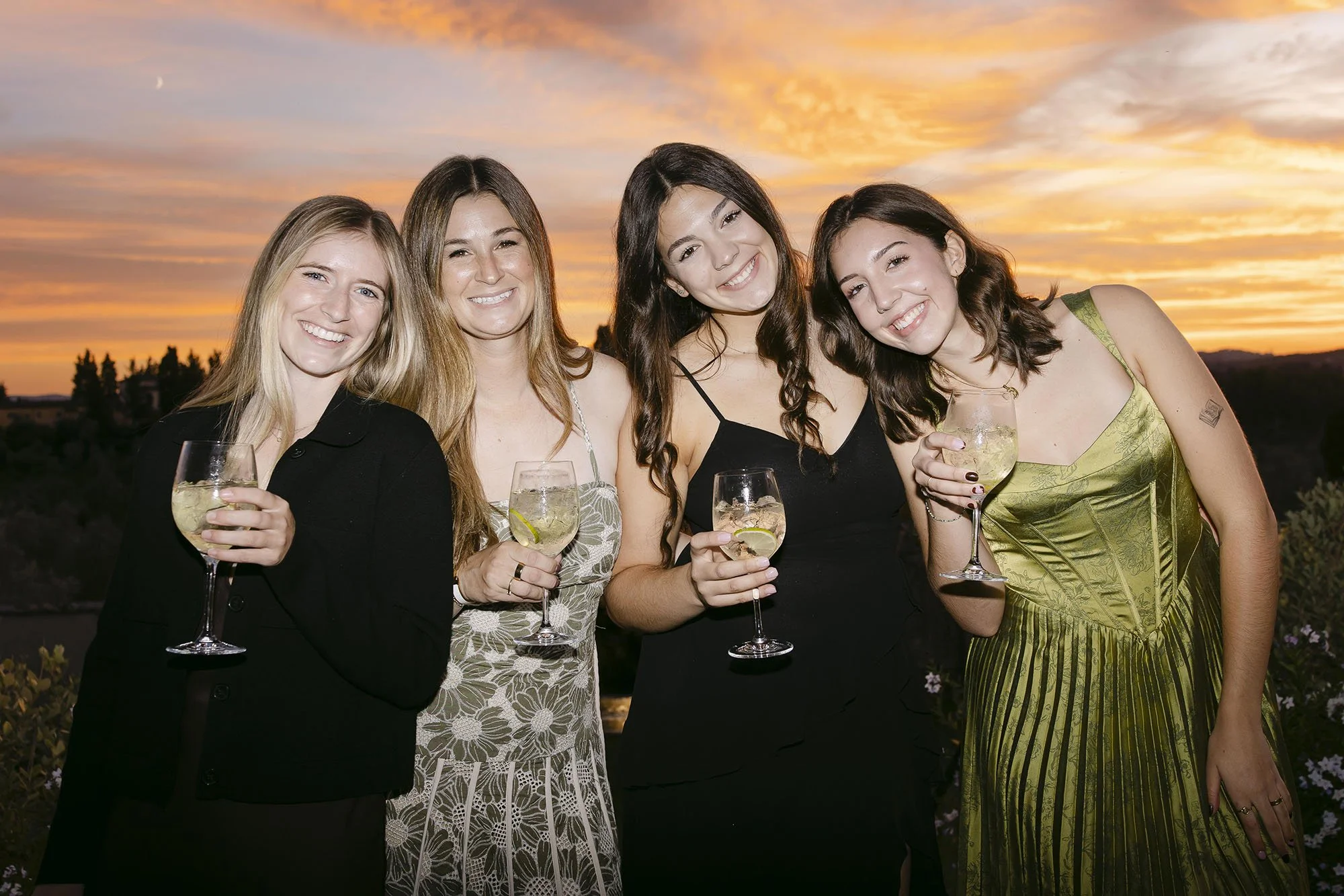 Guests enjoying the cocktail at sunset