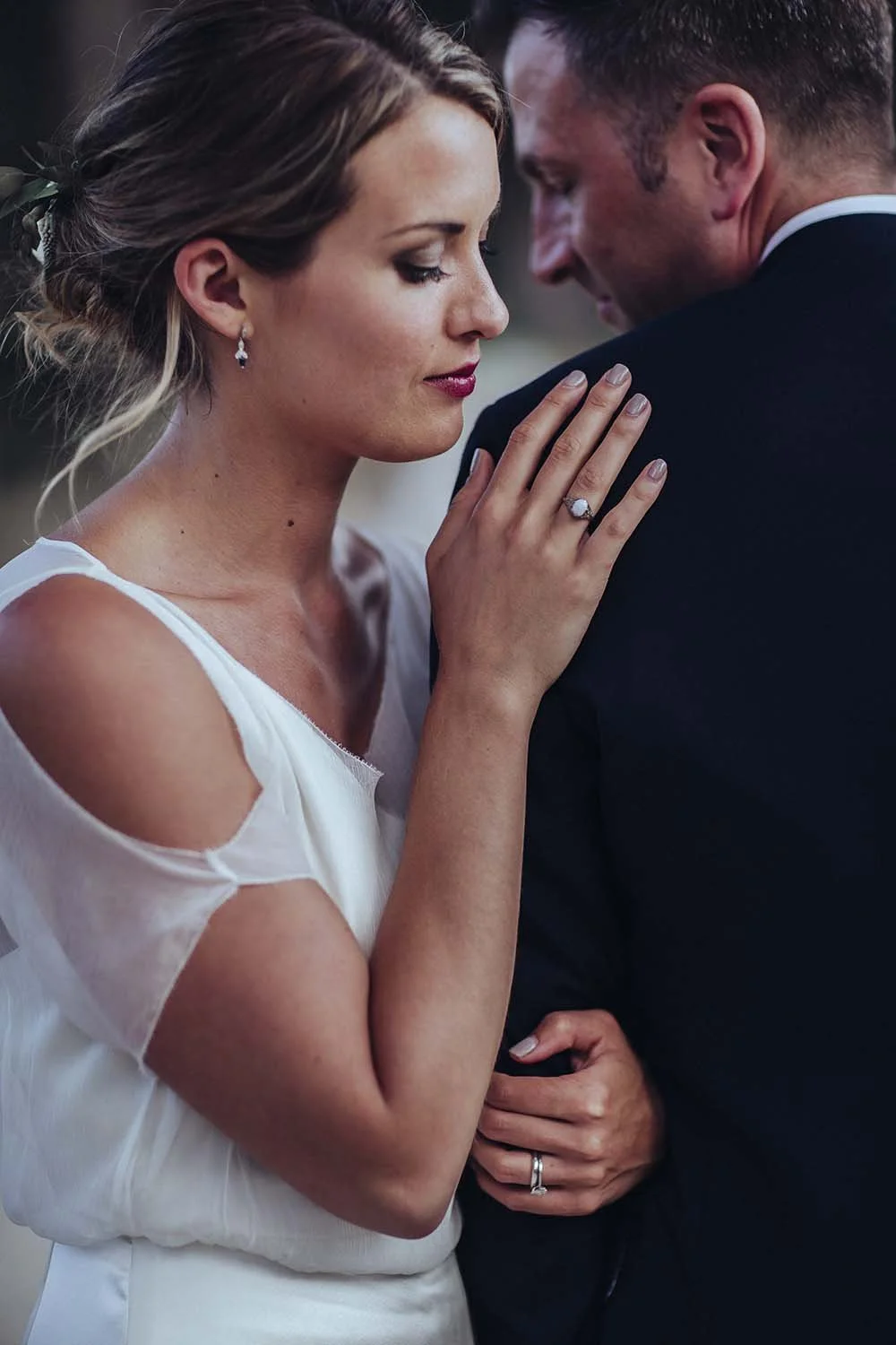 bride and groom holding each other