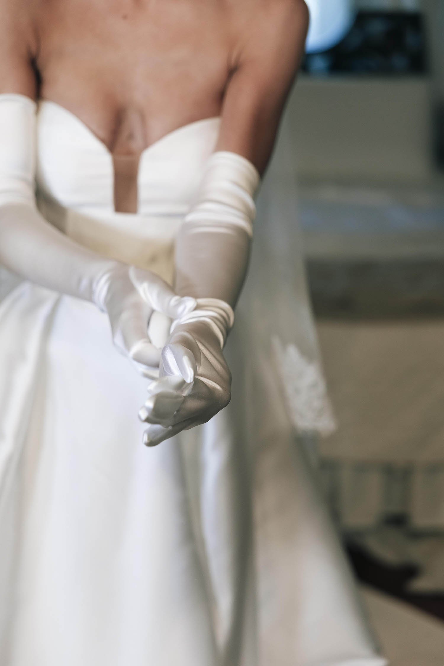 bride putting on her gloves