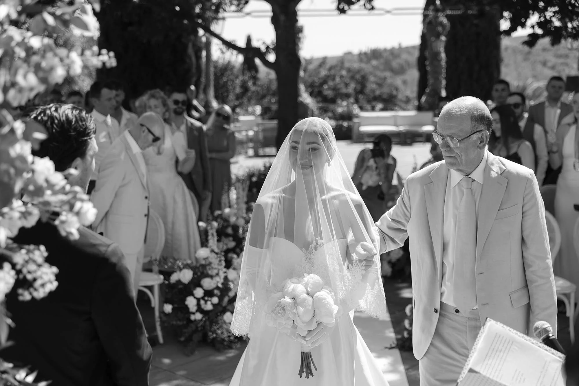 bride walking down the aisle with her father
