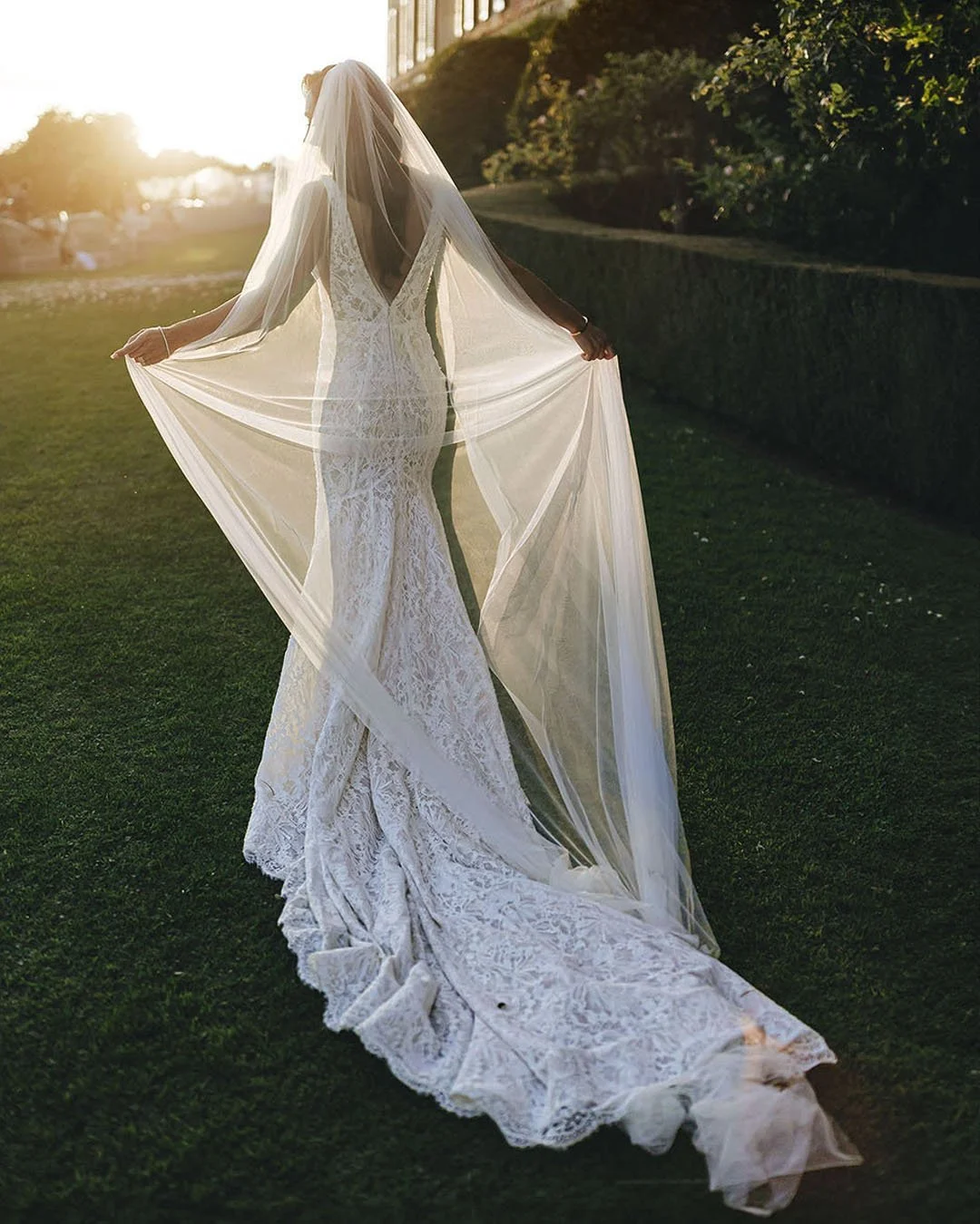 Candid and elegant moment of the bride hit by a sunset light