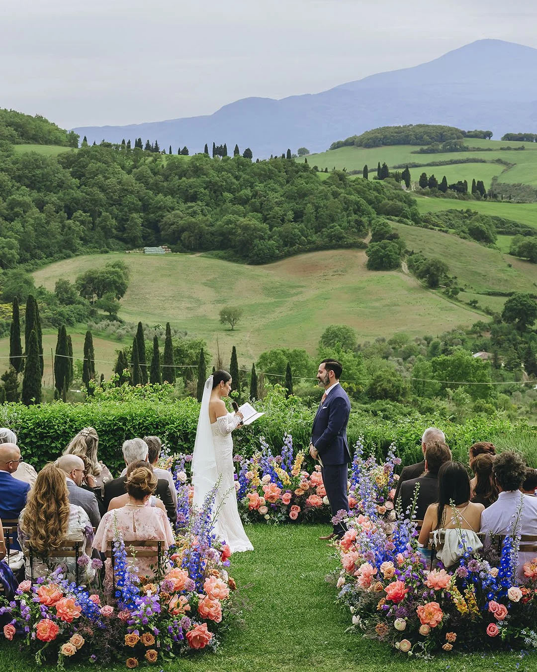 Groom and bride exchanging vows during their ceremony in Siena, photo by Rellini art studio