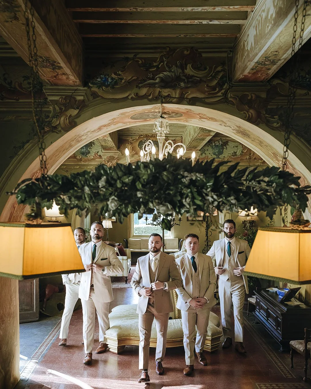 Groom with his groomsmen in a room at Borgo Stomennano