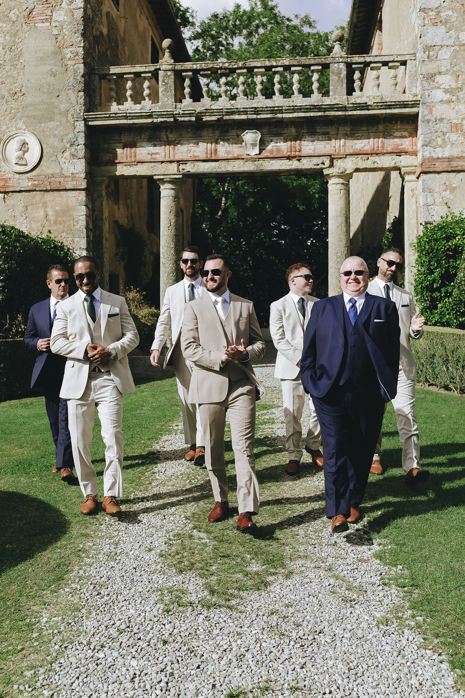 groom walking down the aisle with his groomsmen