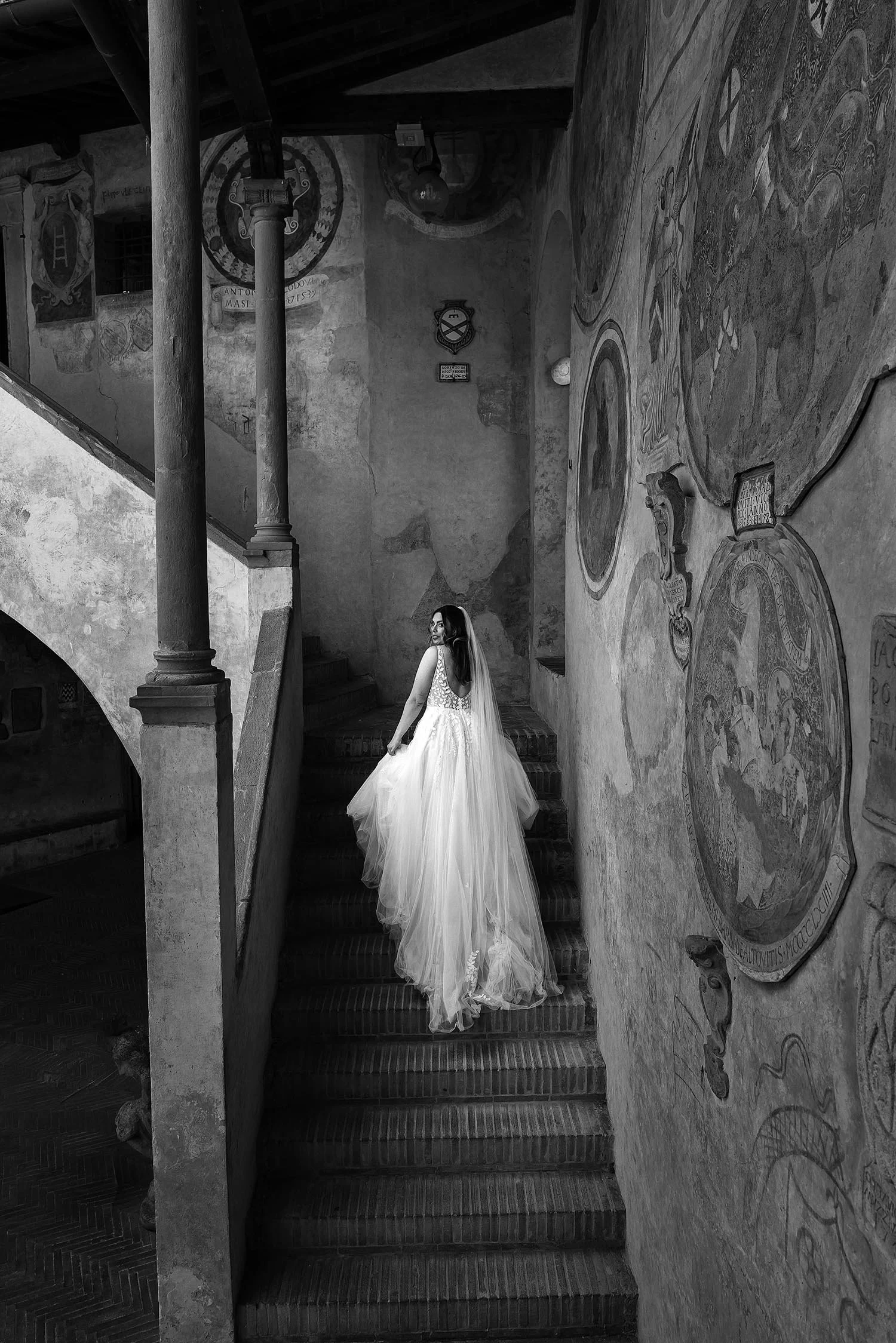 Artistic photo of the bride walking up the stairs in Certaldo