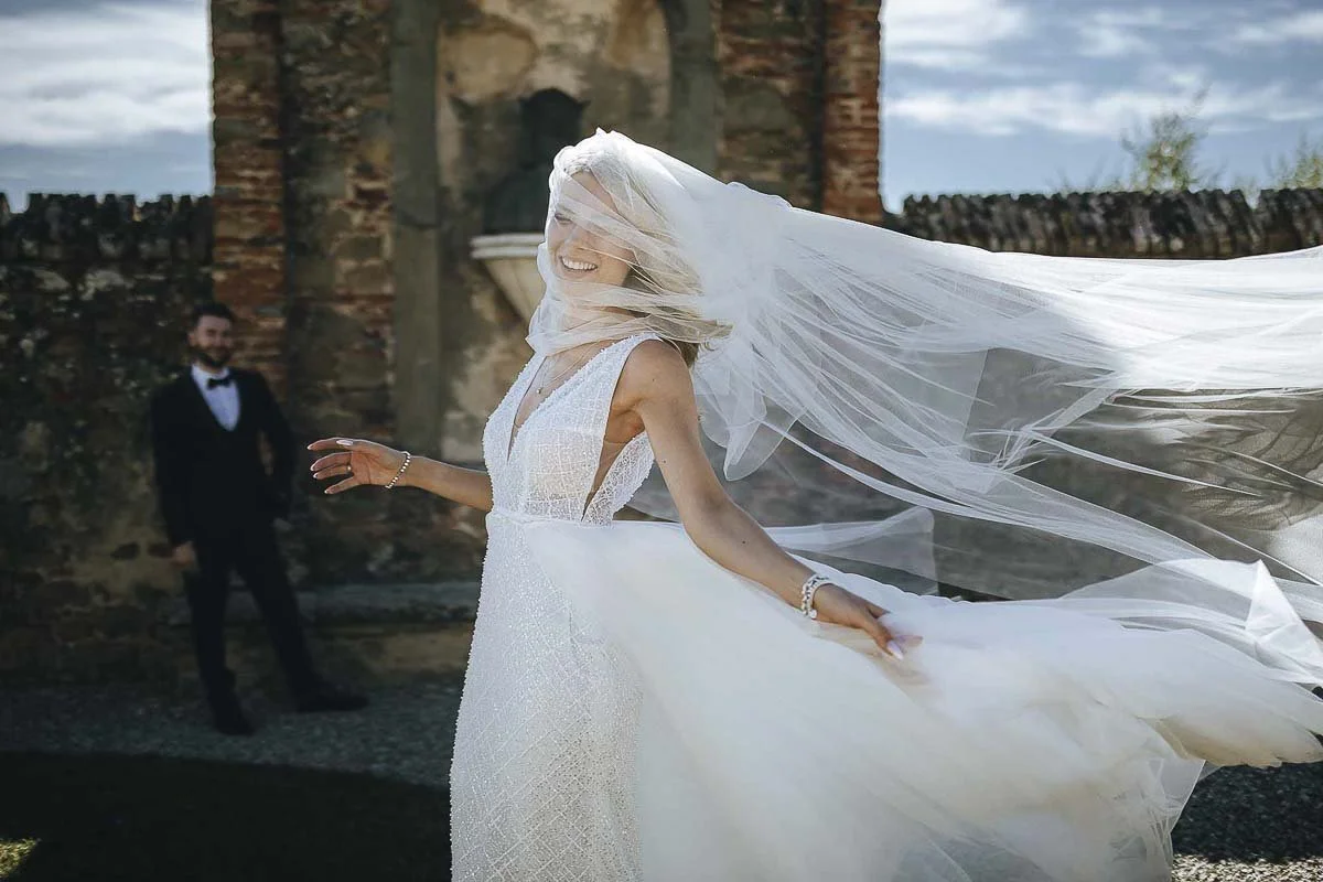 Bride under the veil and looking very candid, photo in Siena by Rellini art studio