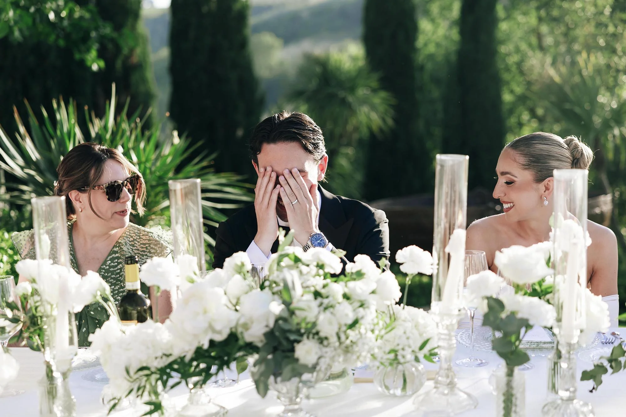 the groom laughing during the speeches