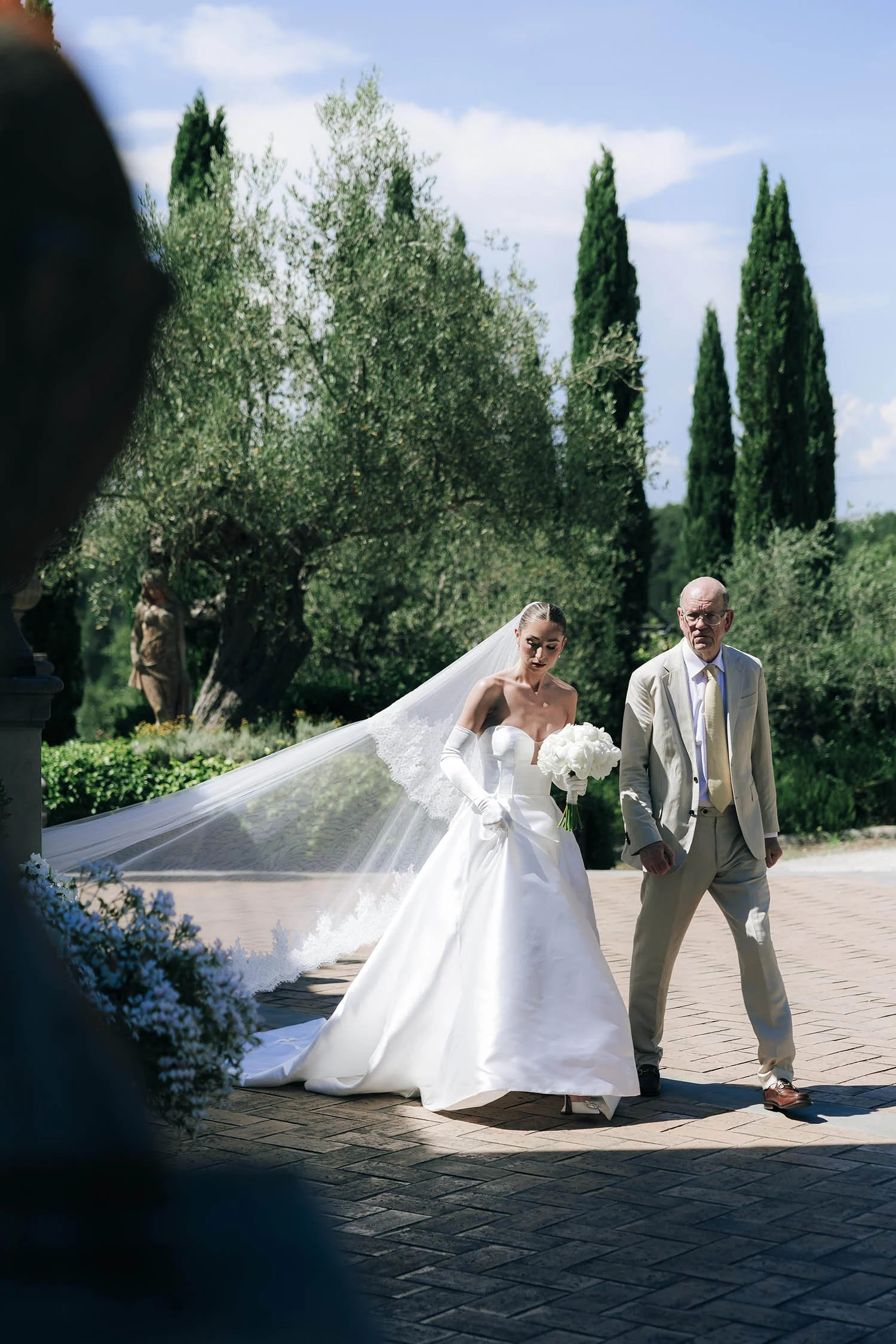 bride walking down the aisle with her father