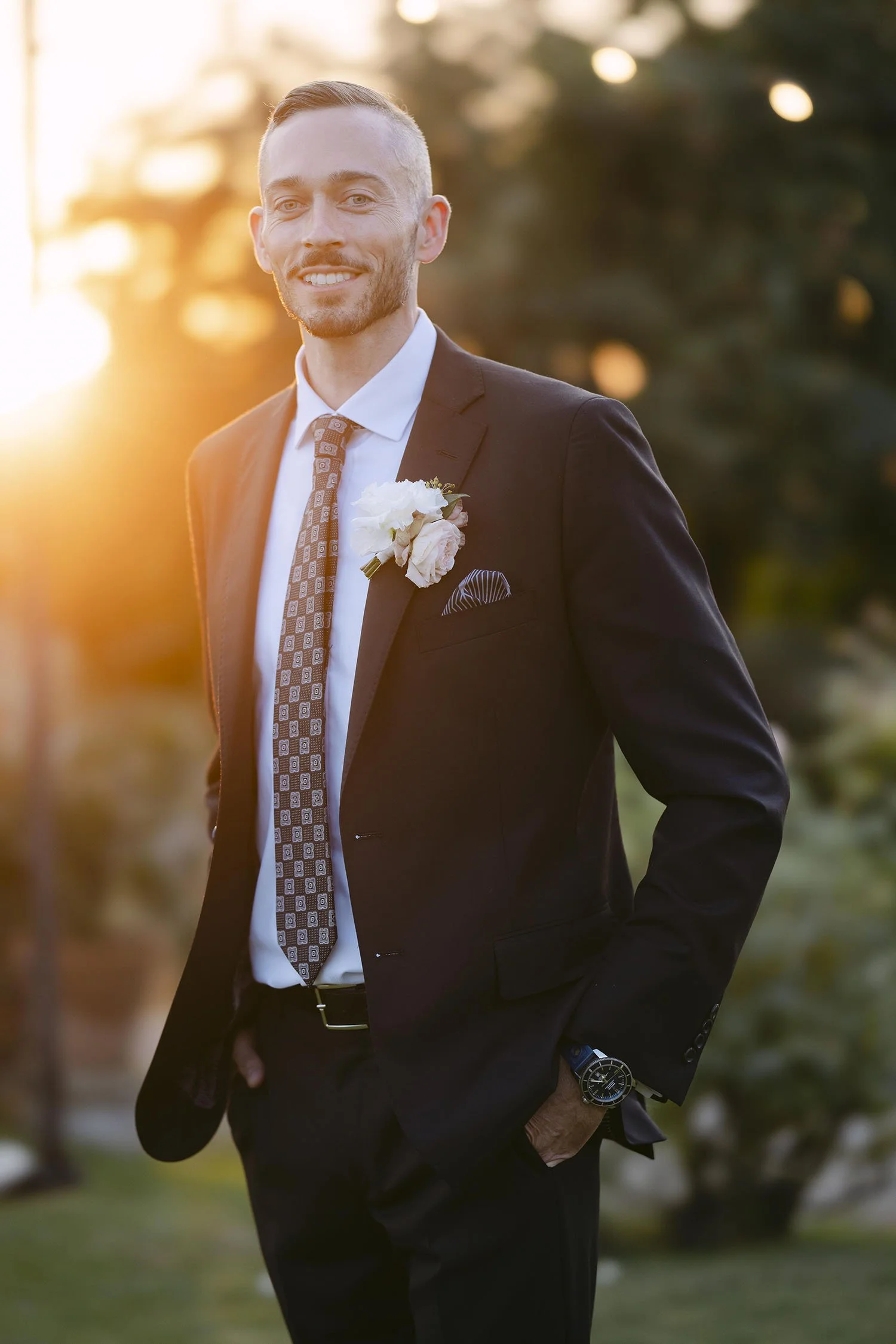 Portrait of the groom at sunset