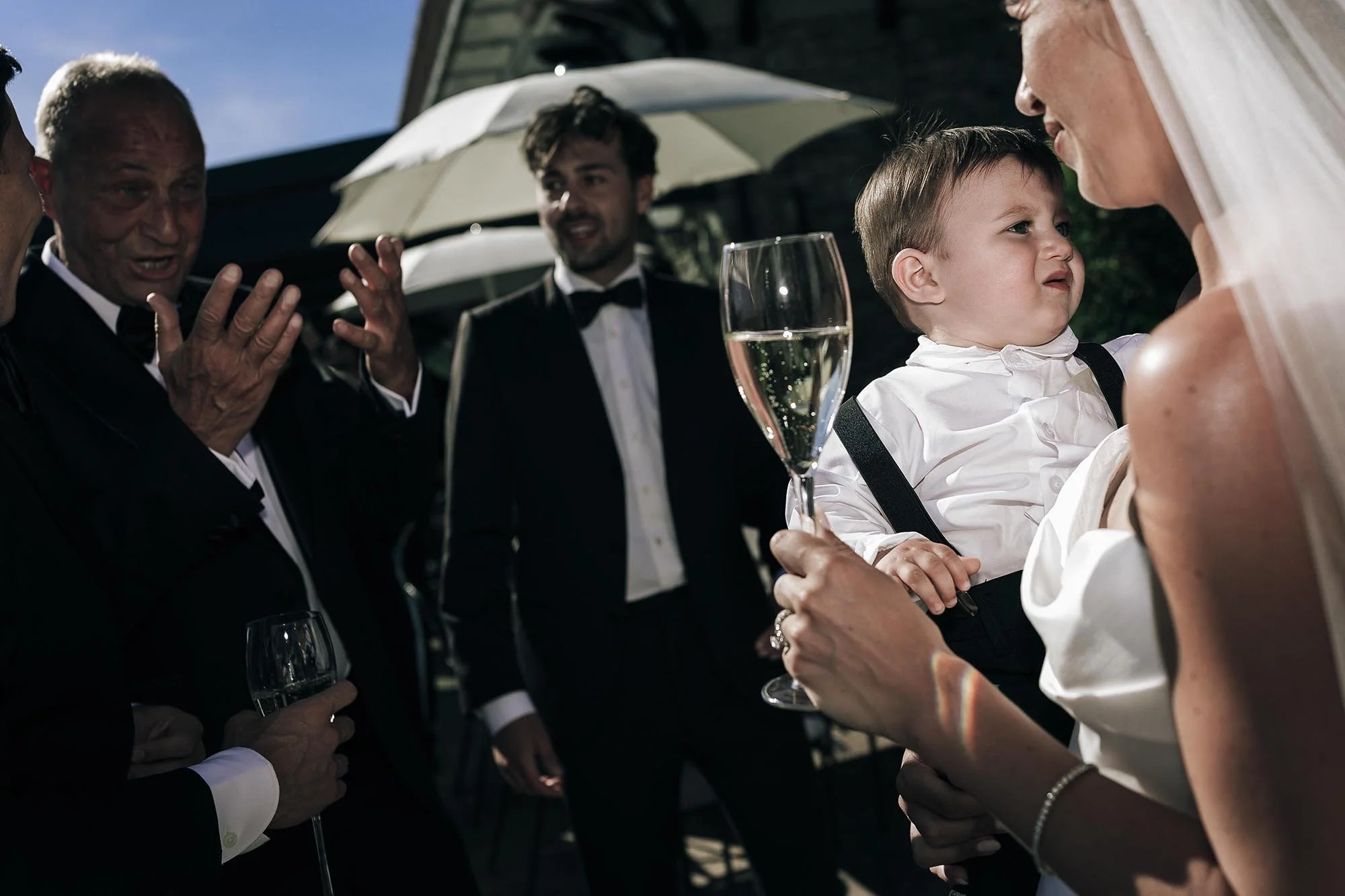 moment of the bride holding her son 