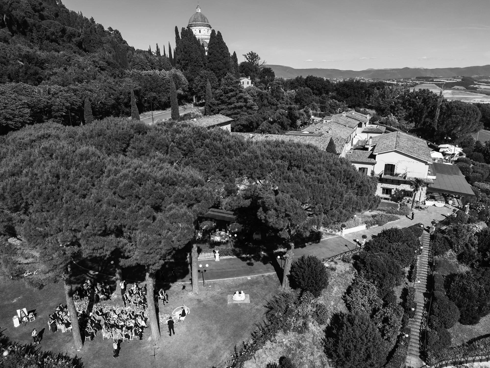 aerial view of the ceremony with Monastero Santa Margherita in the background and the town of Todi
