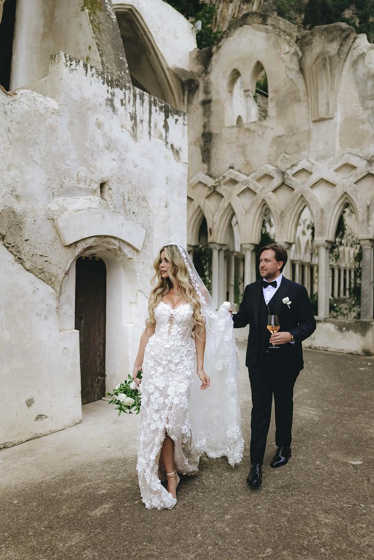Bride and groom walking together after the ceremony at Hotel Convento Anantara hotel il Amalfi. Photo by Rellini art studio destination wedding photographer in Amalfi