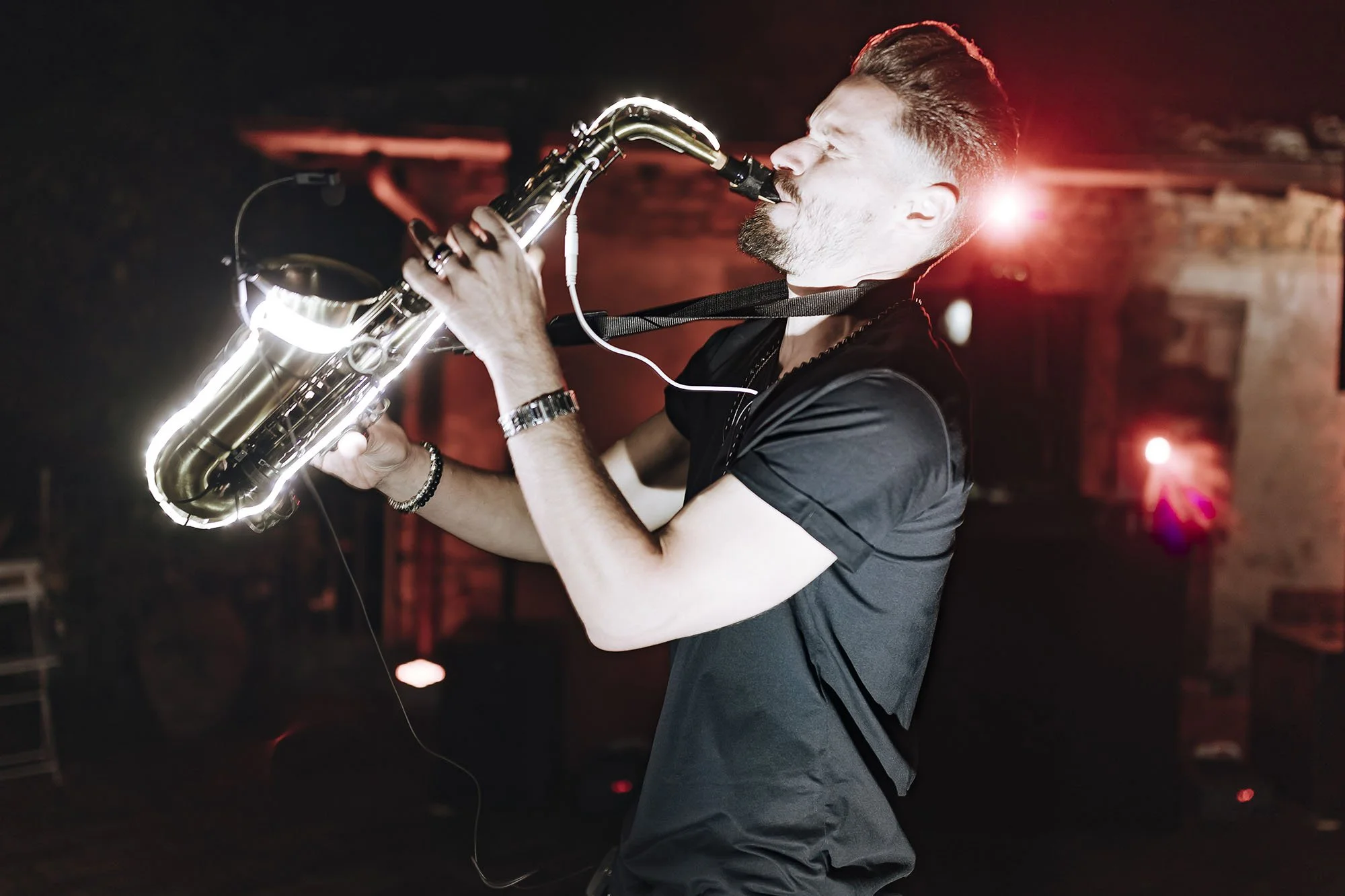 sax player playing music during the party