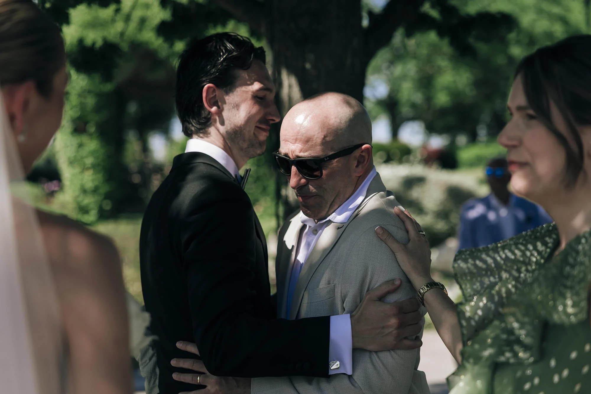 guests approach bride and groom to hug kiss and celebrate