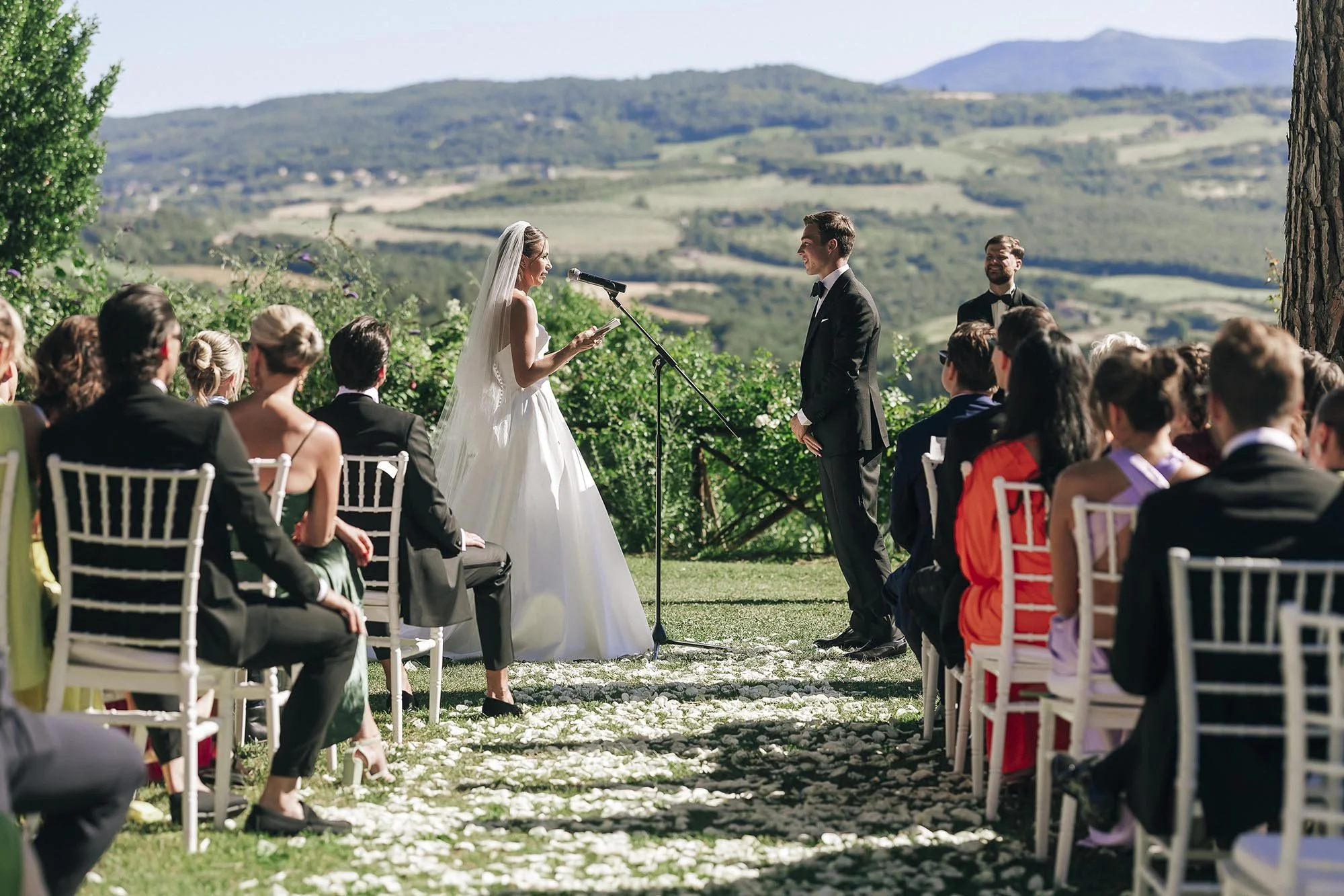 groom and bride exchanging vows facing each other