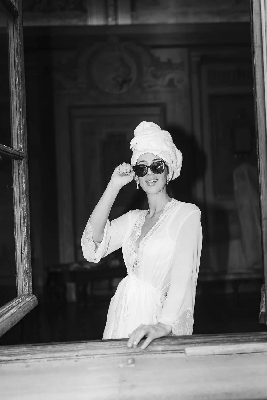 Destination wedding at Castello di Montegufoni in Florence, photo by Rellini art studio documentary wedding photographers in Tuscany. Editorial style of the bride looking magazine worthy during the getting ready