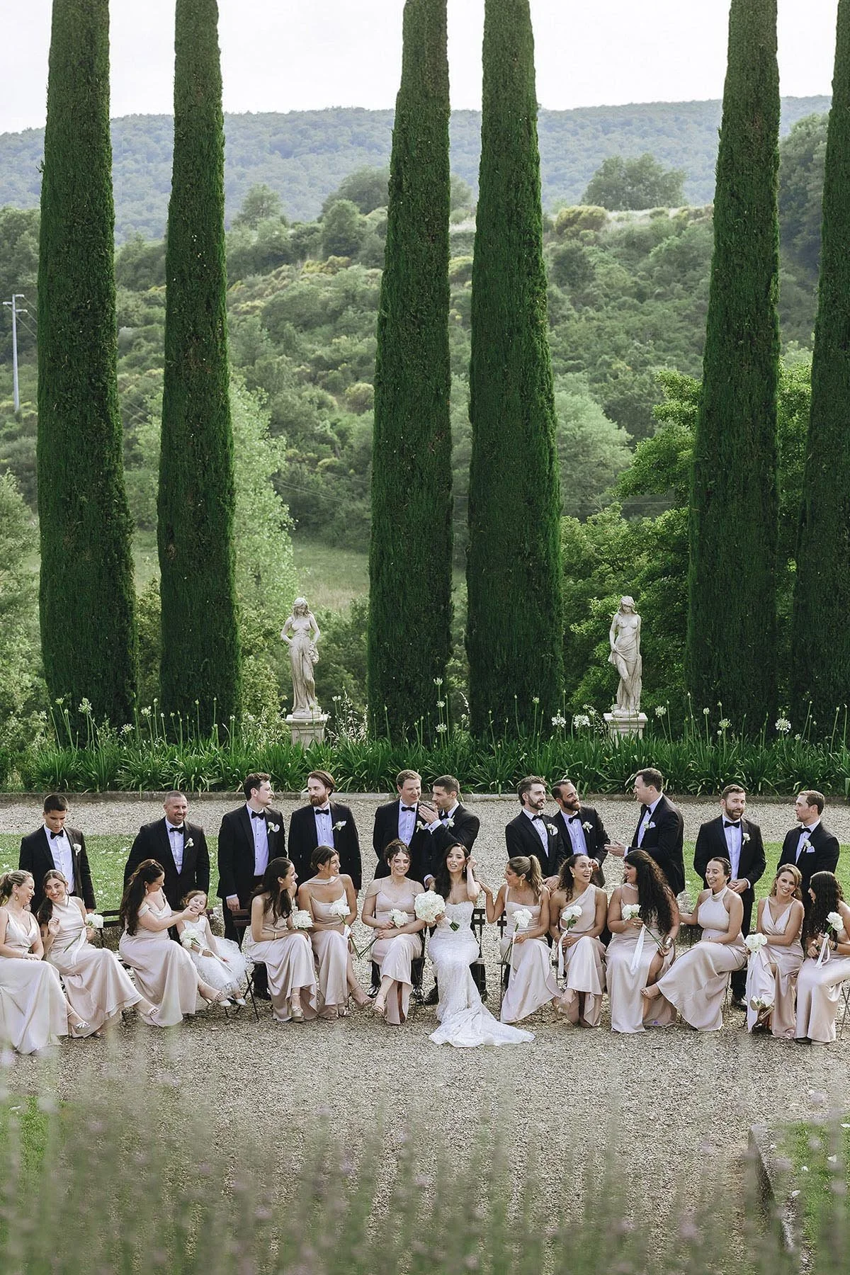 bridal party group photo with cypresses in the background