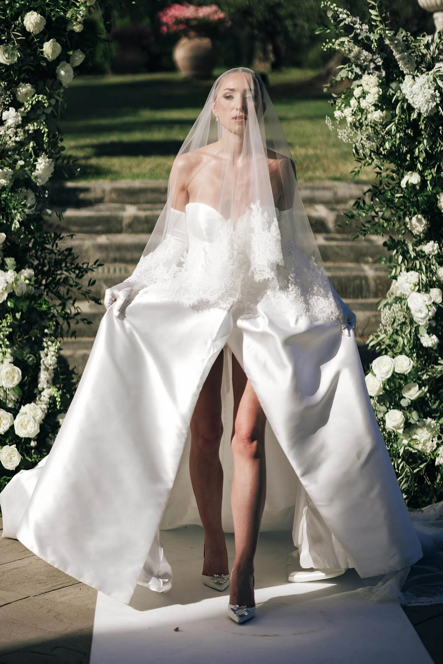 the bride looking at the camera under the veil