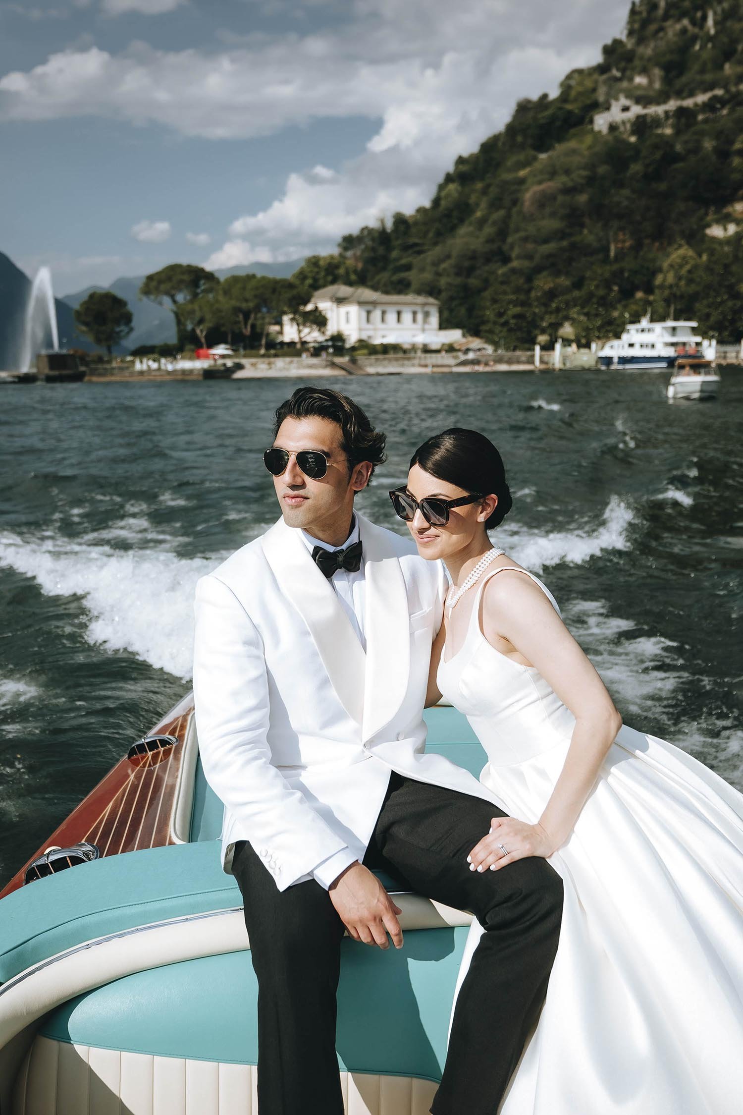 Indian bride and groom on a boat in Lake Como looking classy and elegant. photo by Rellini art studio, destination wedding photographers in Amalfi coast