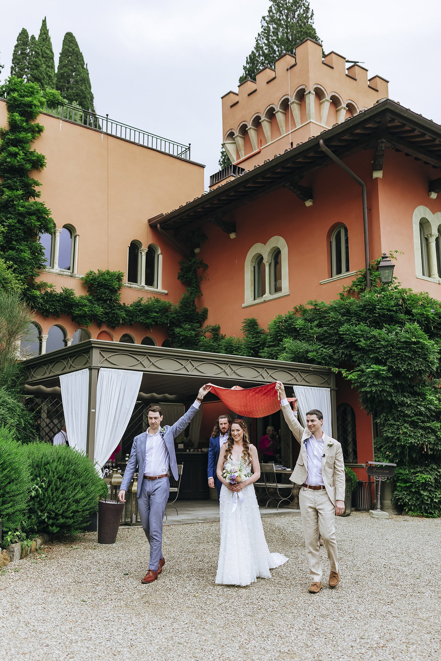 bride walking to the ceremony on a destination wedding in Florence at Villa le Fontanelle