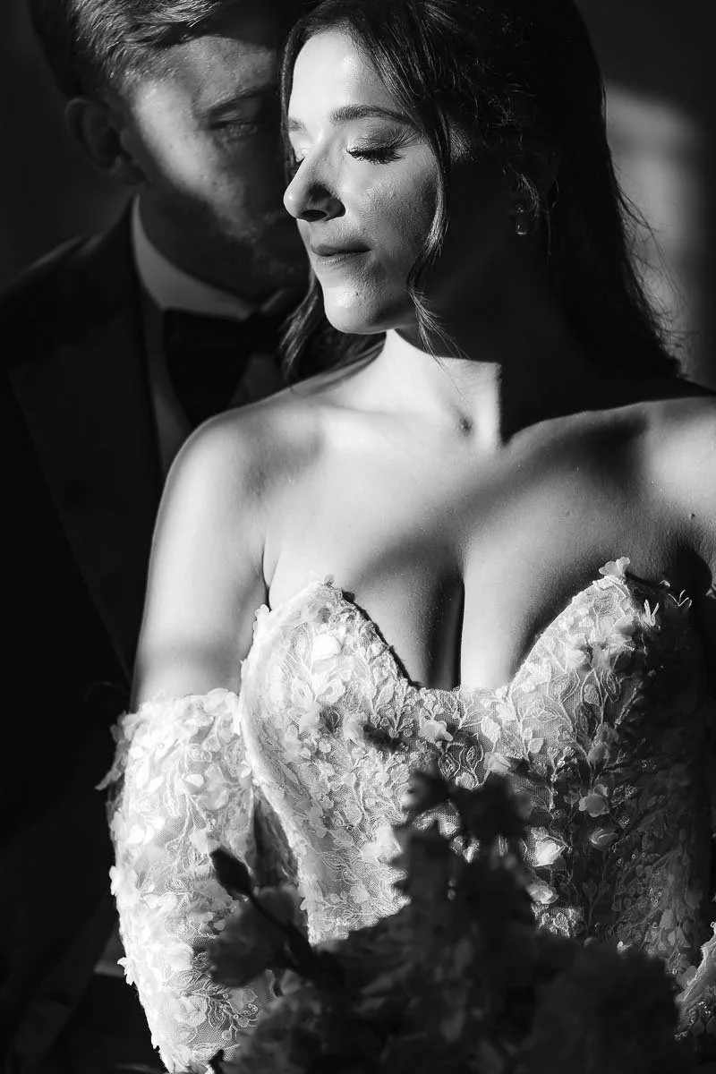 bride and groom intimate portrait with a dramatic light at Villa Catignano