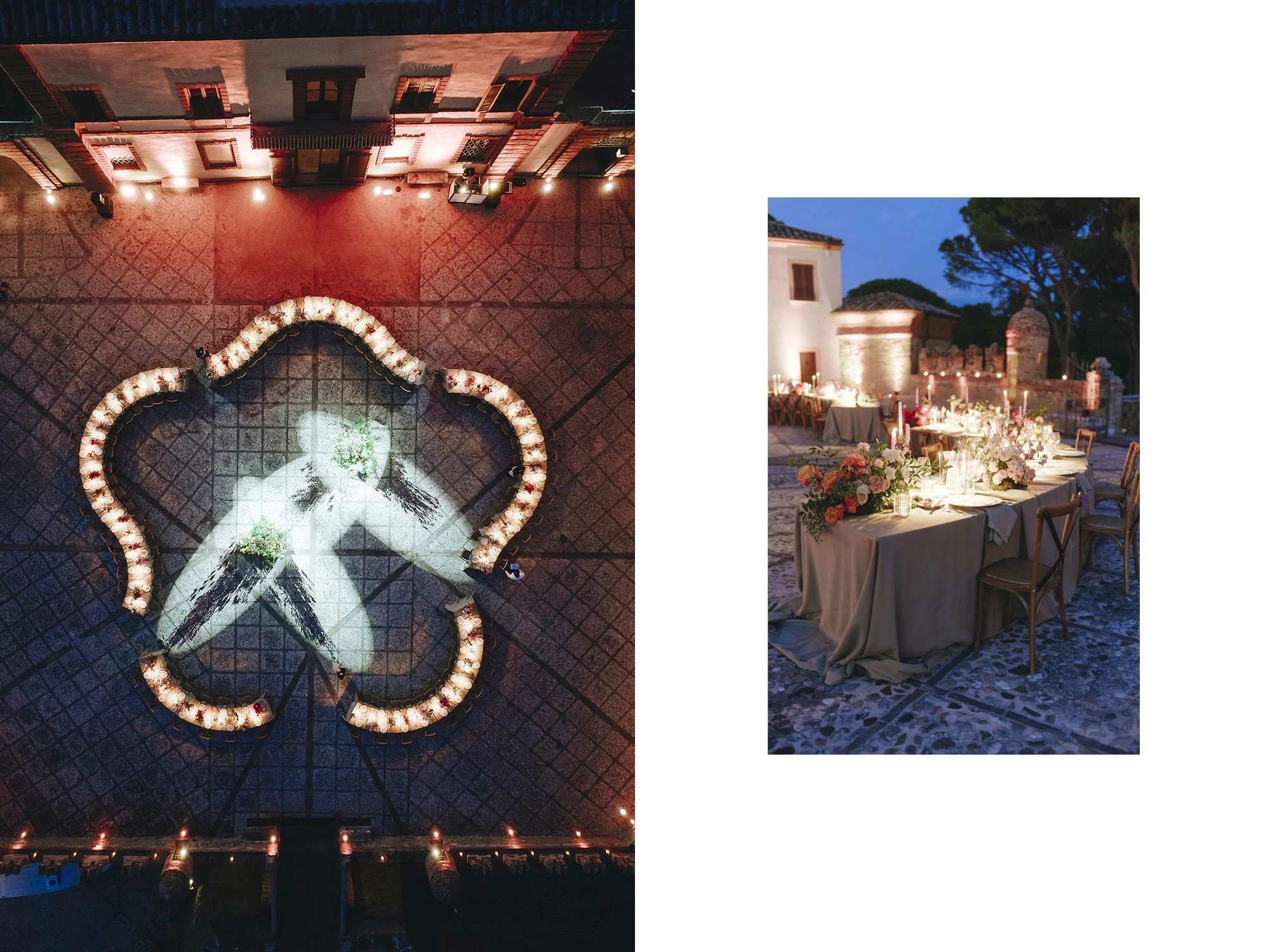 Outdoor evening setting with a long table decorated with flowers, candles, and tableware, against a background of historic stone buildings and trees.