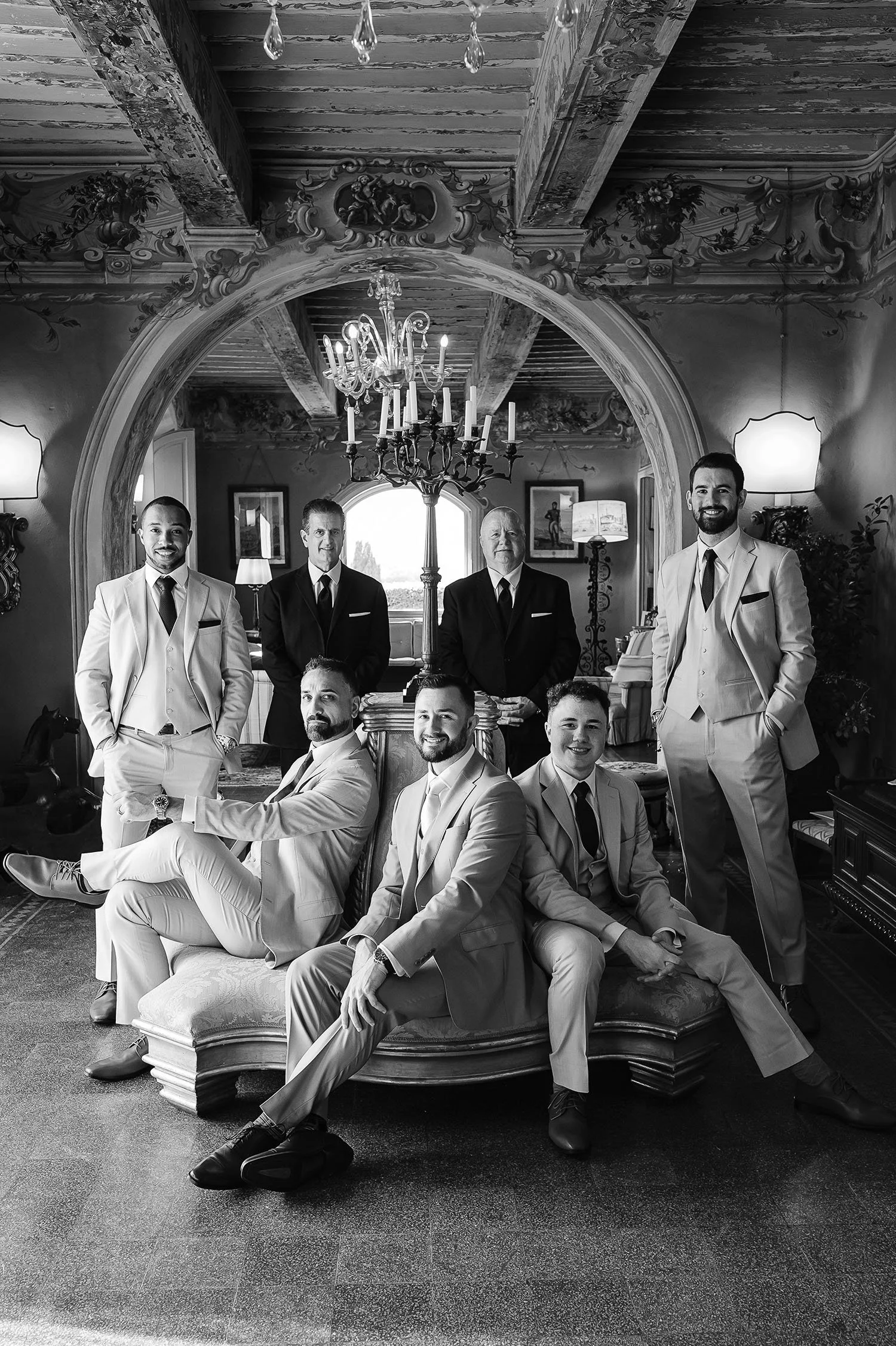 the groom getting ready with his groomsmen in the beautiful room at Borgo di Stomennano
